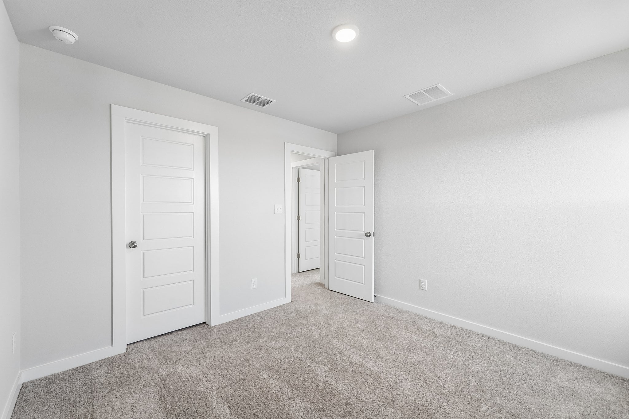 A room with white doors.