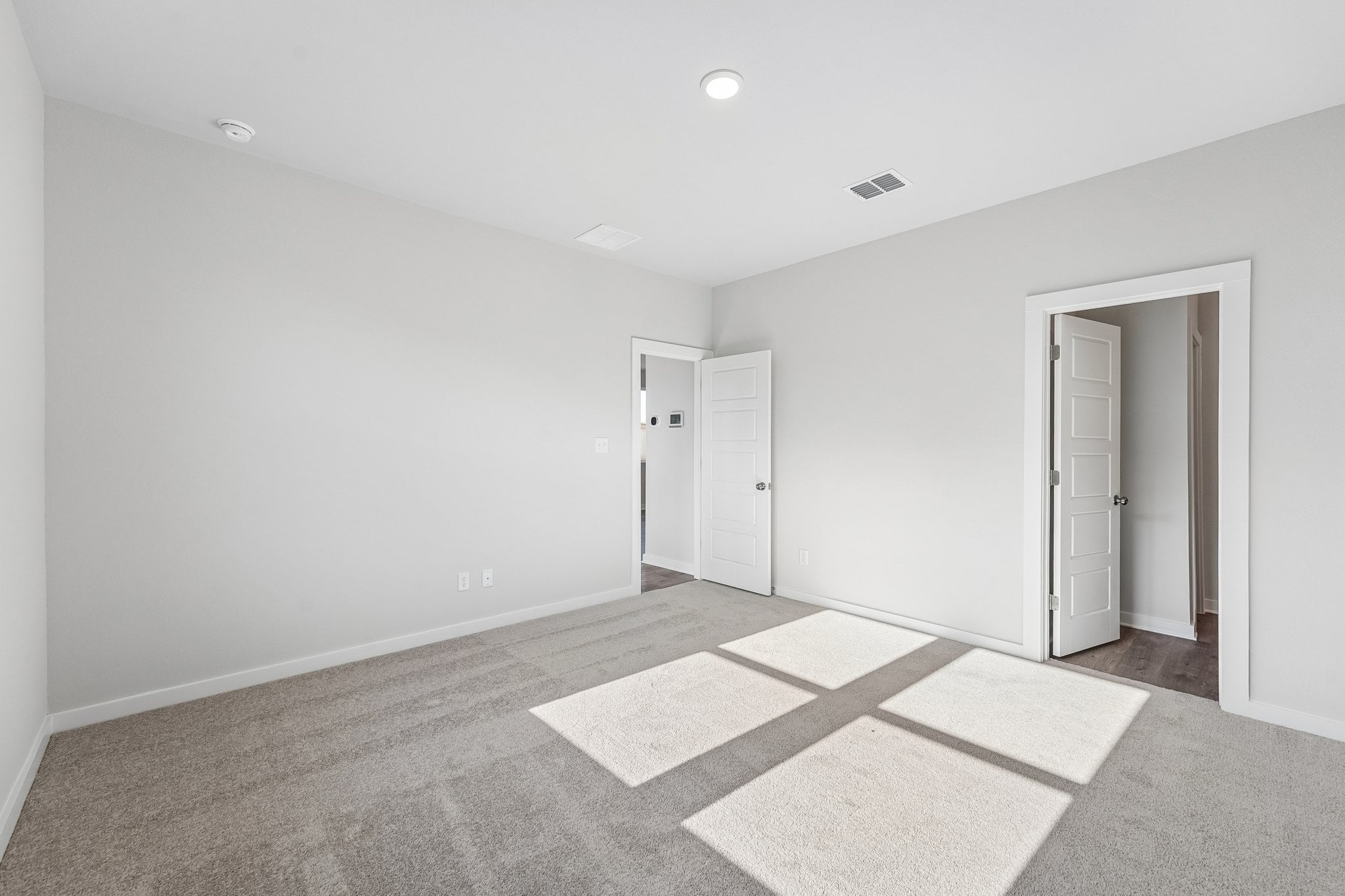 A room with white doors.