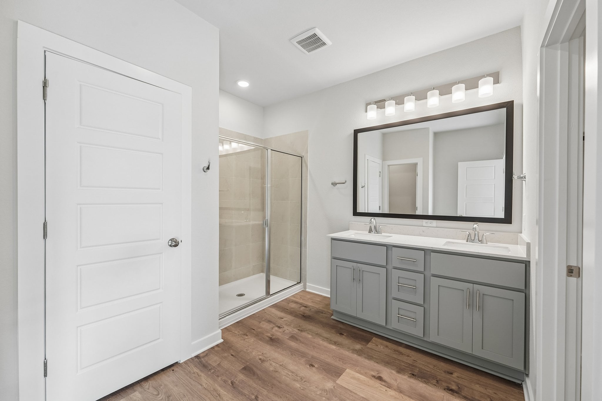 A bathroom with a glass shower.