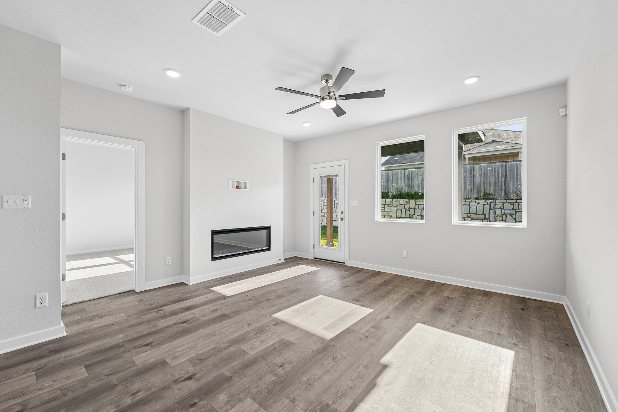 A room with a wood floor and a wood floor with a wood floor.