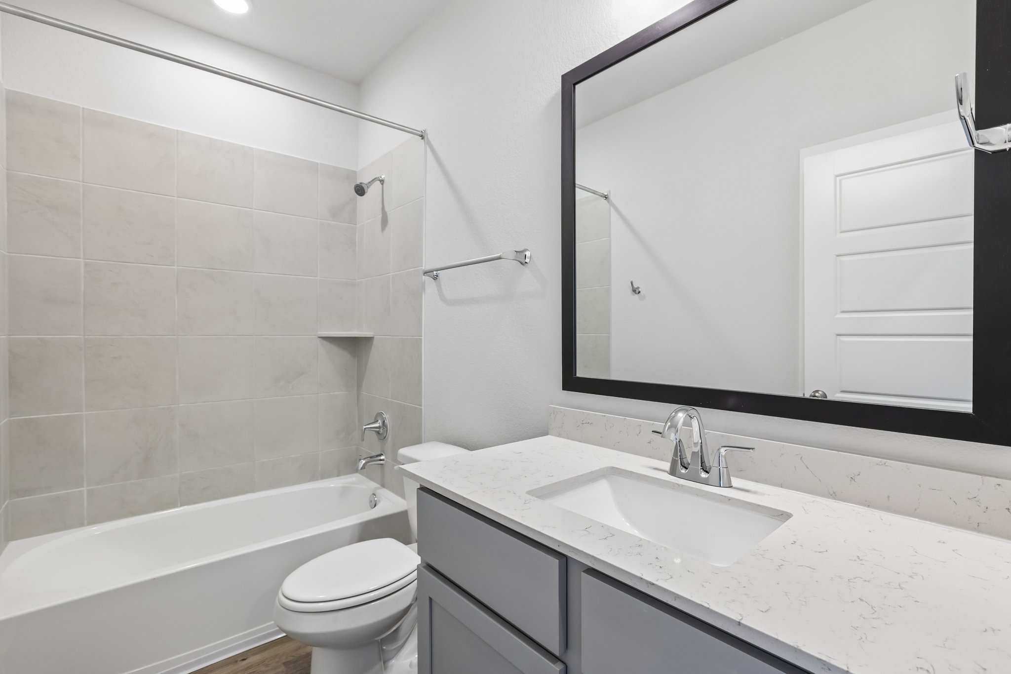 A bathroom with a sink and a toilet.
