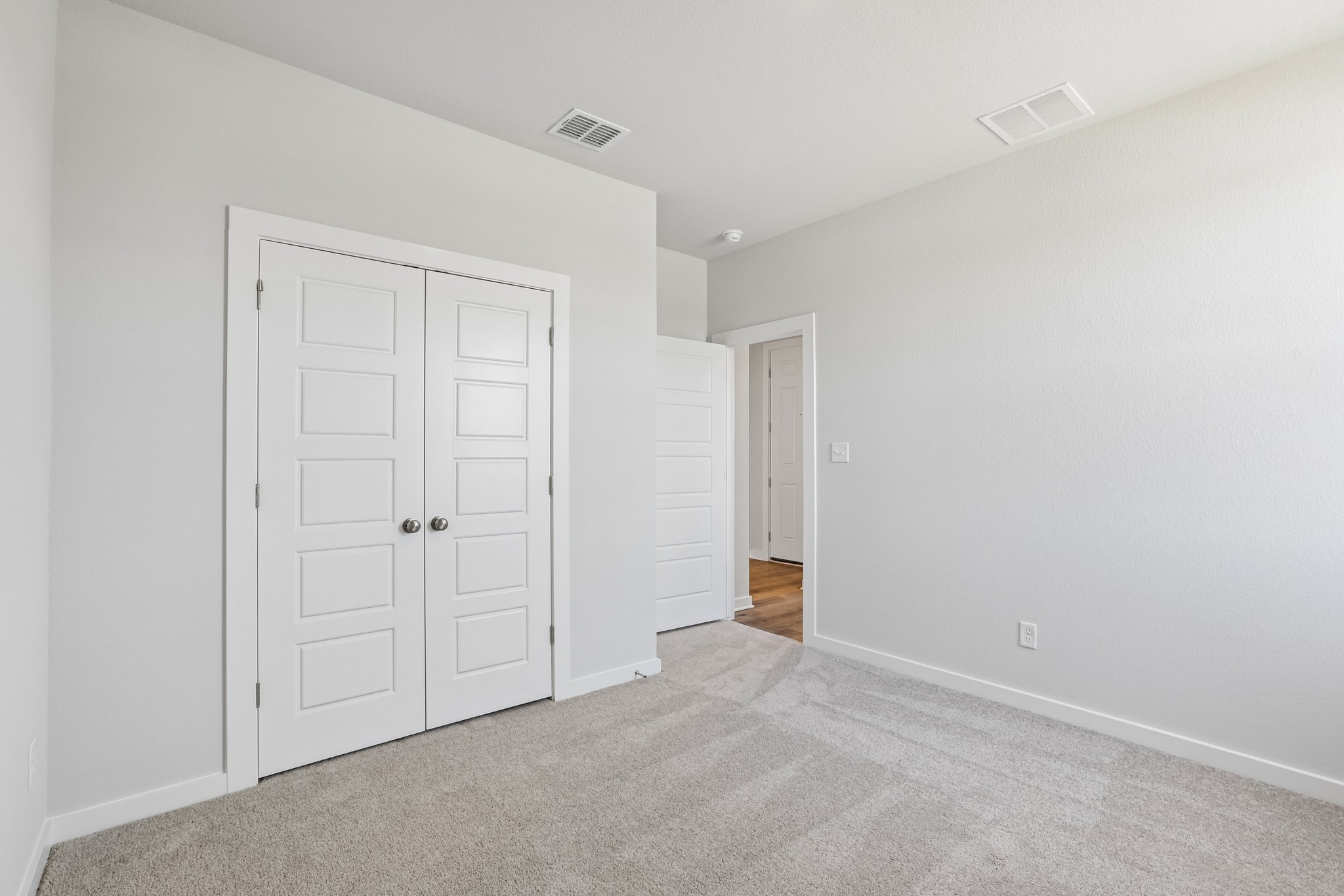 A room with white doors.