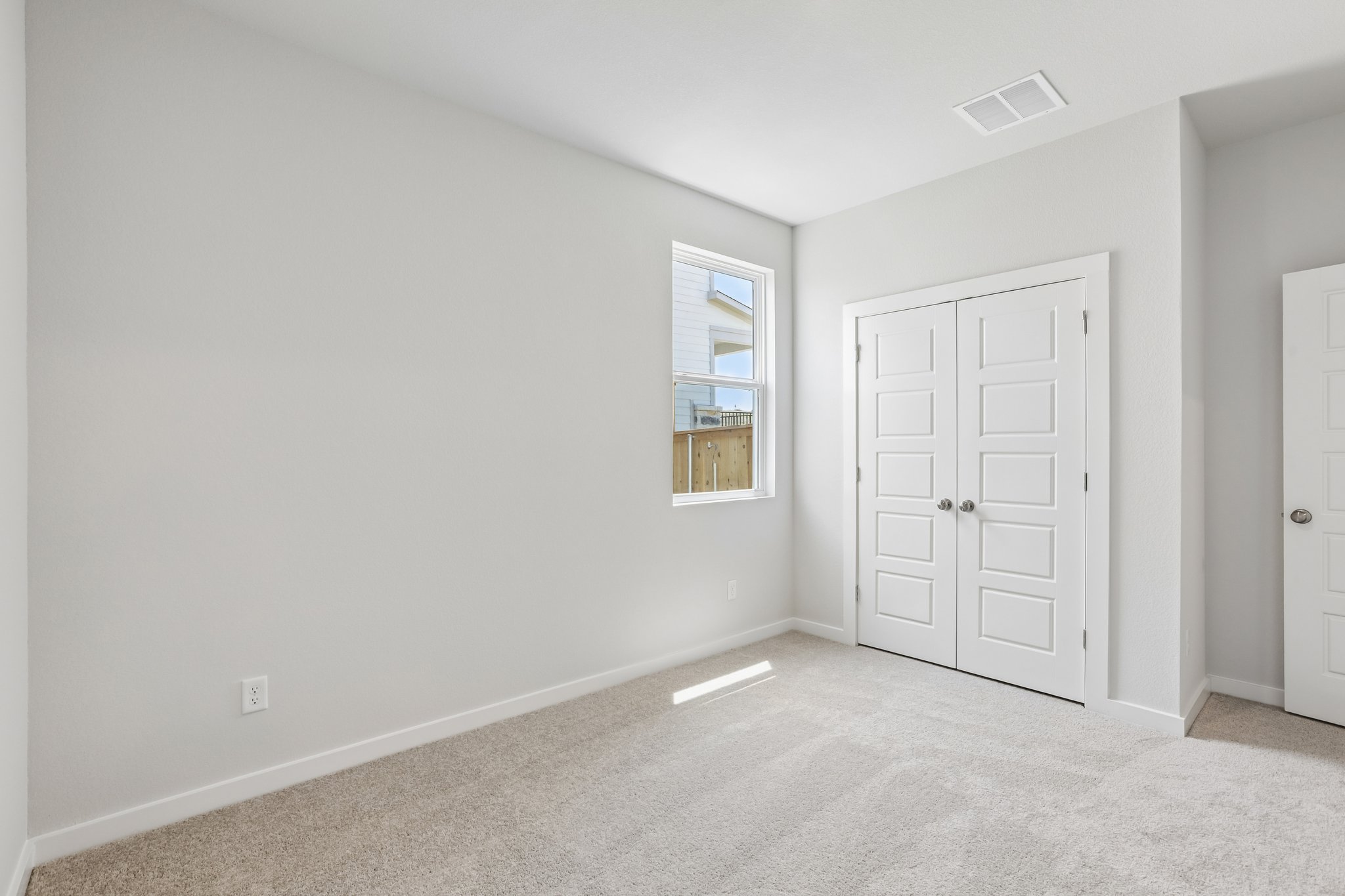 A room with white doors.