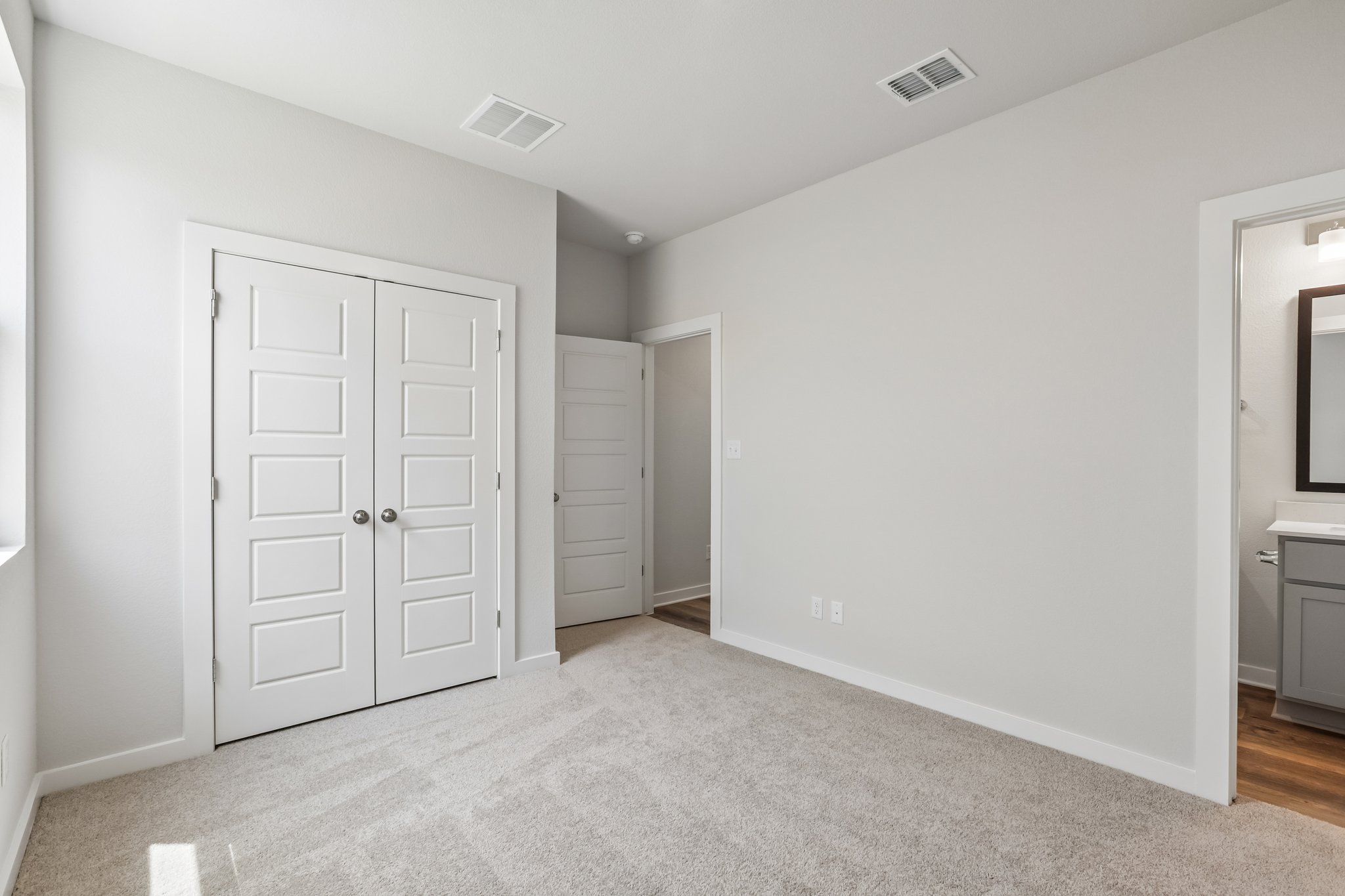 A room with white doors.