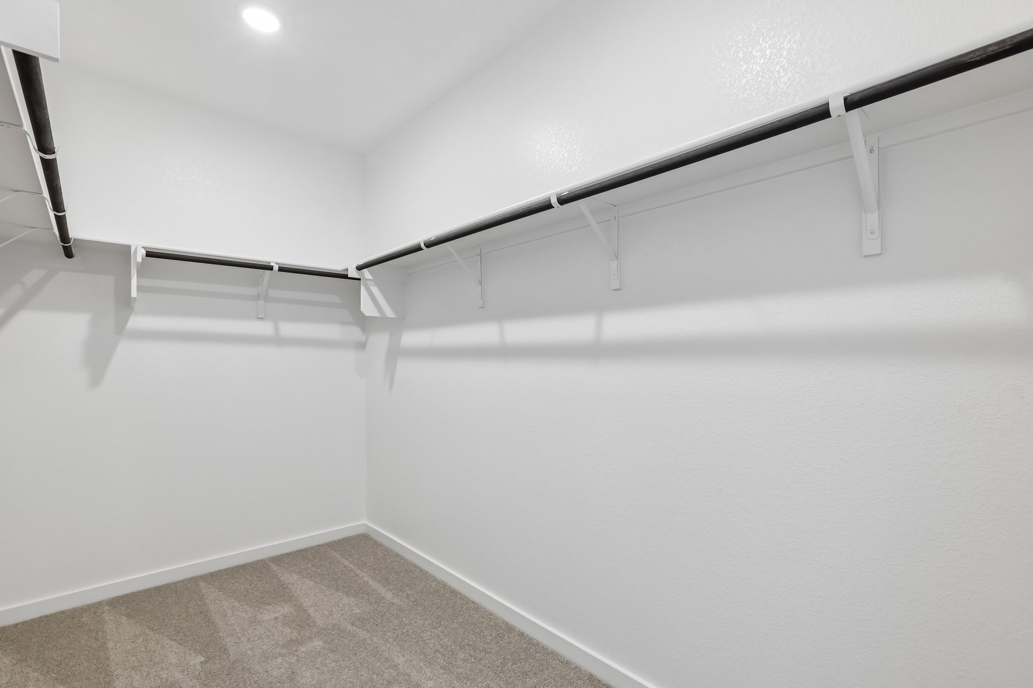 A white wall with a staircase.