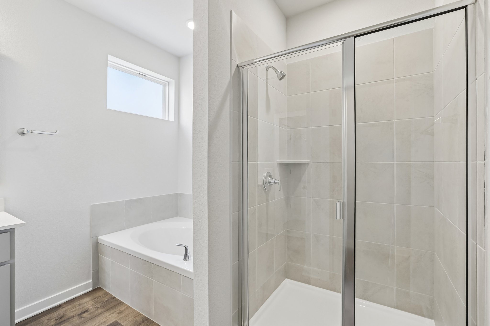 A bathroom with a glass shower.