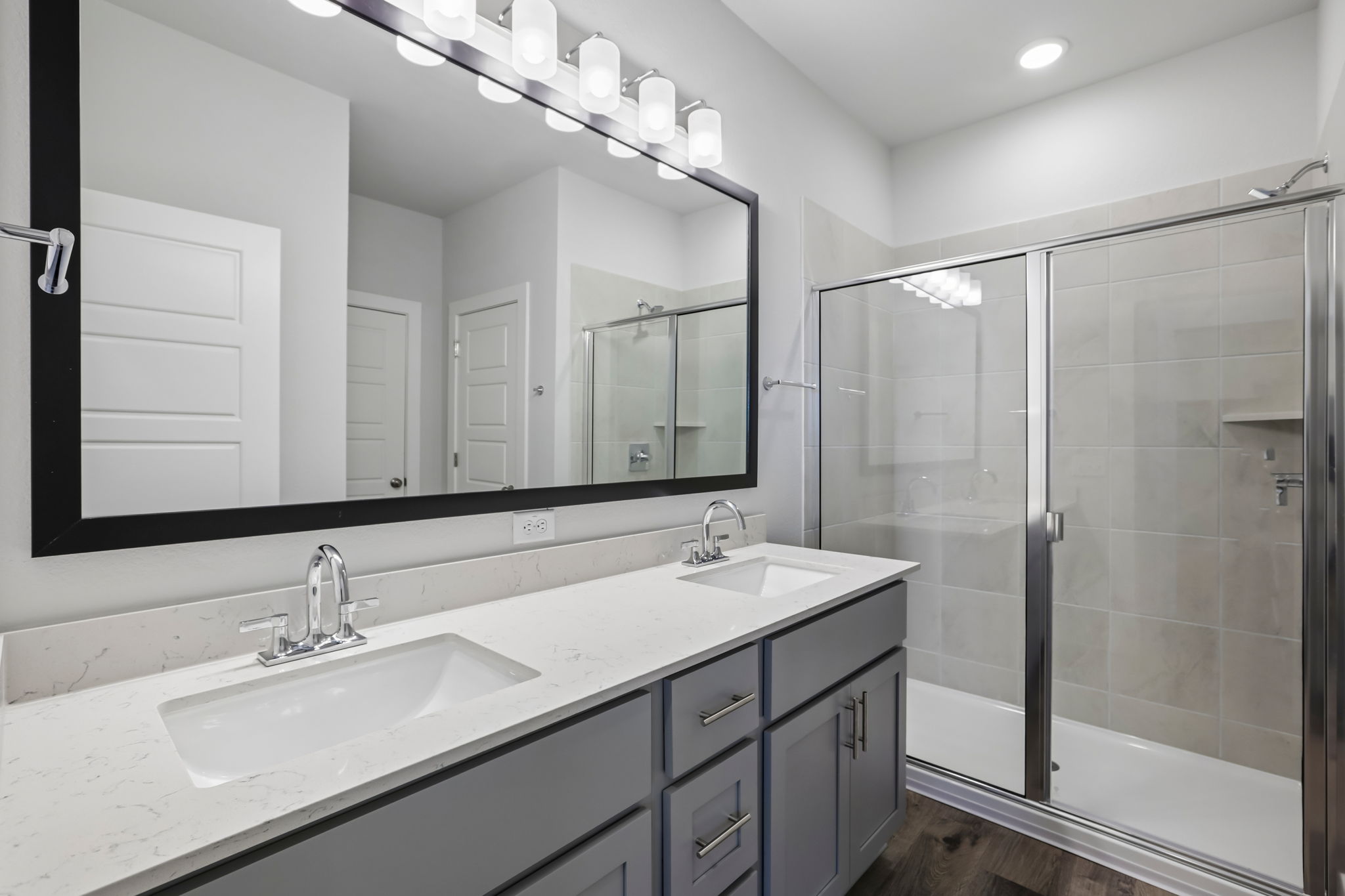 A bathroom with a glass shower.