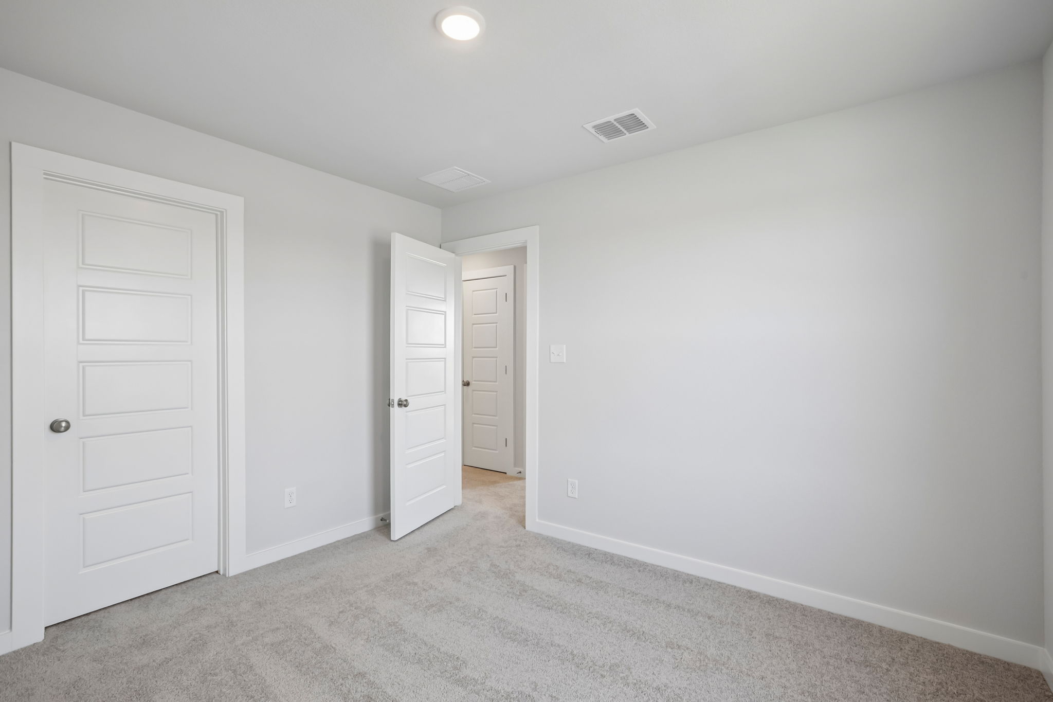 A room with white doors.