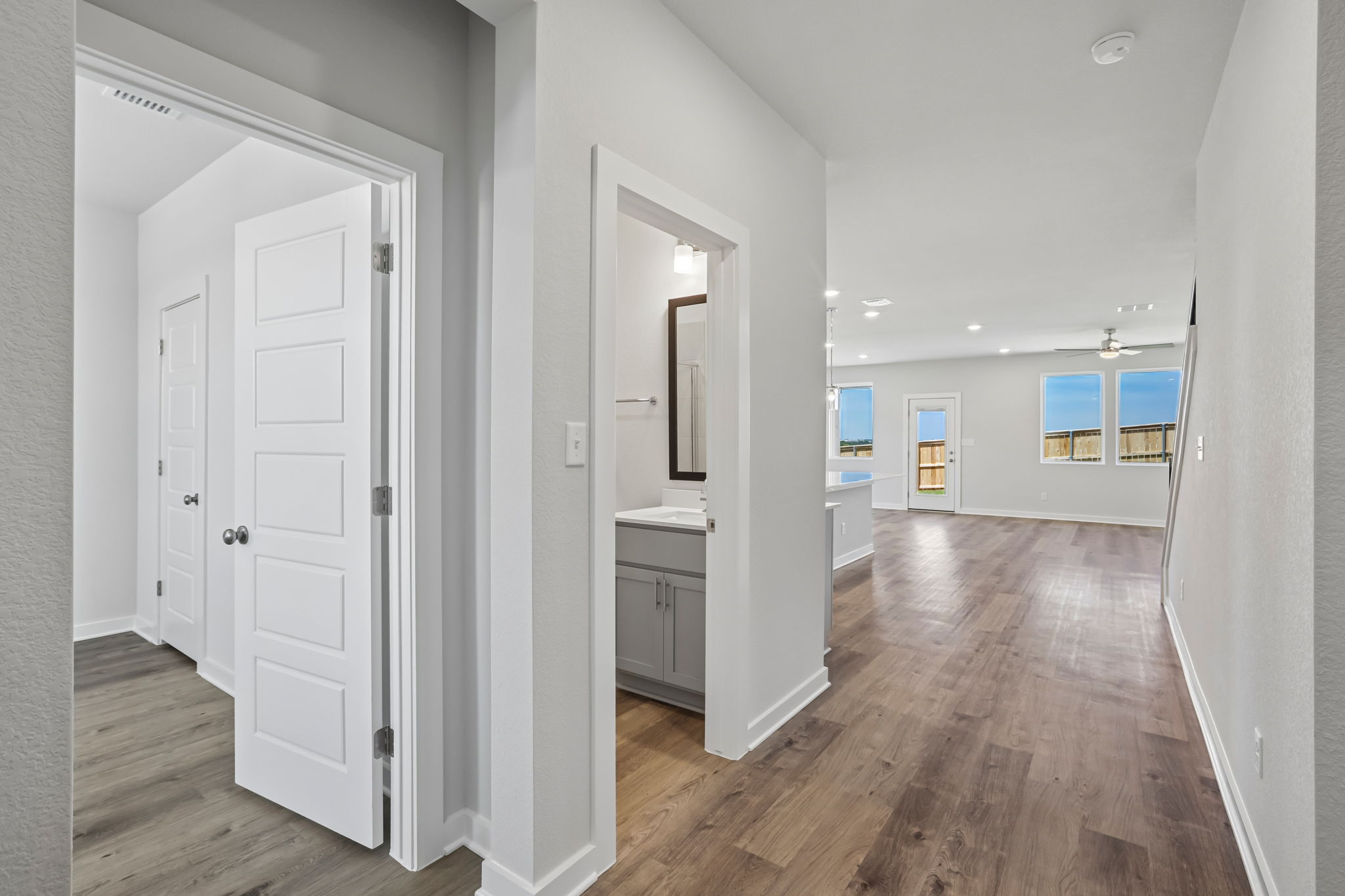 A room with white walls and a wood floor.
