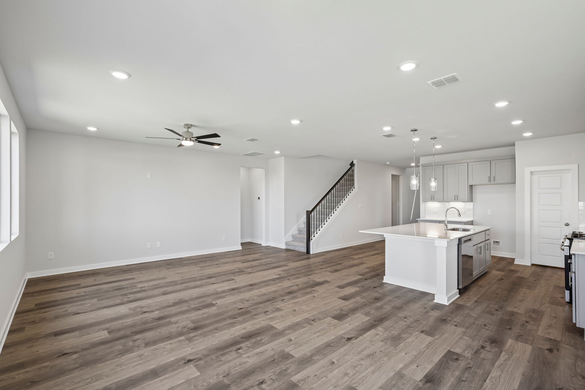 A large kitchen with white cabinets.