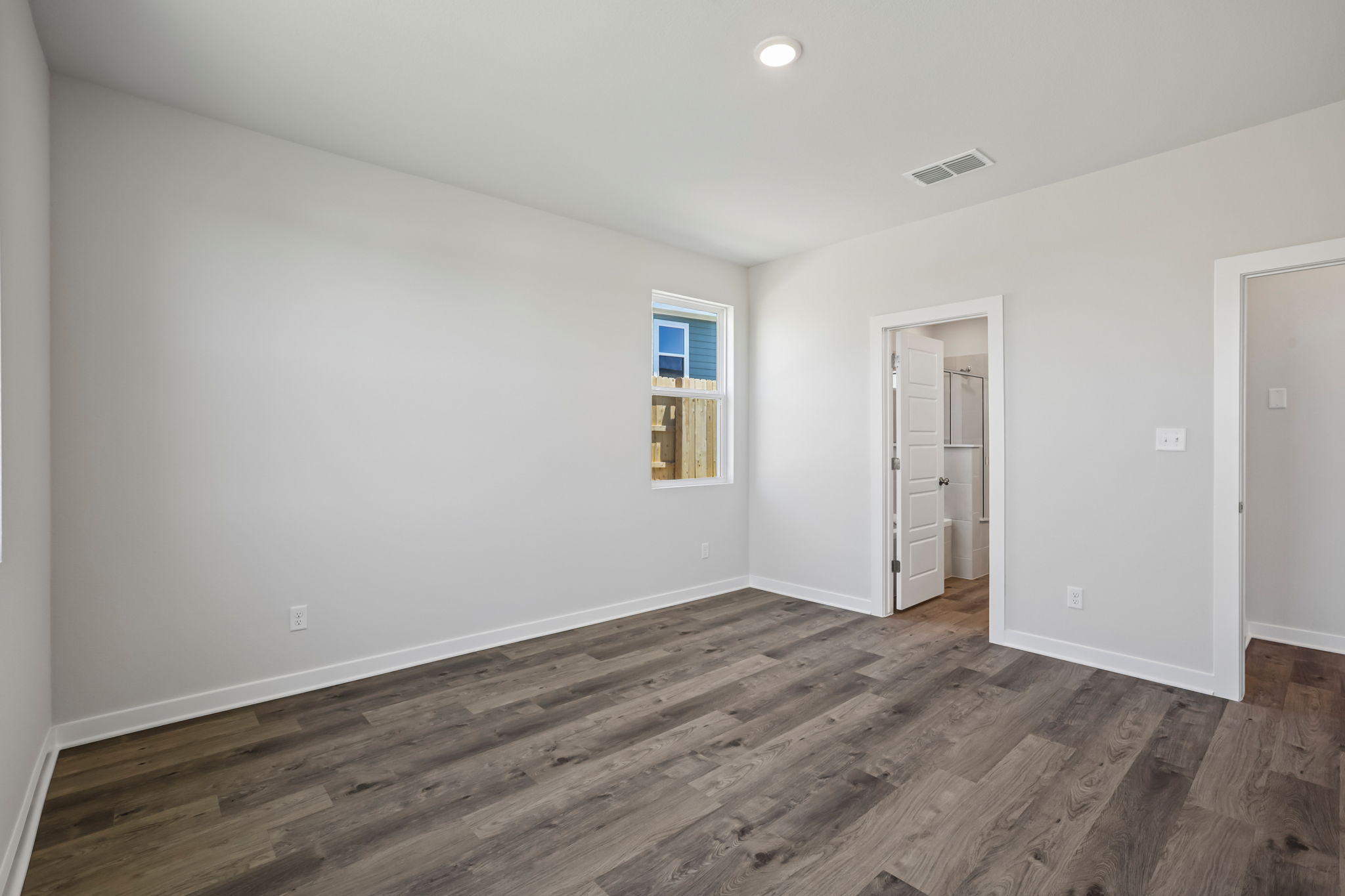 A room with a wood floor and a wood floor.