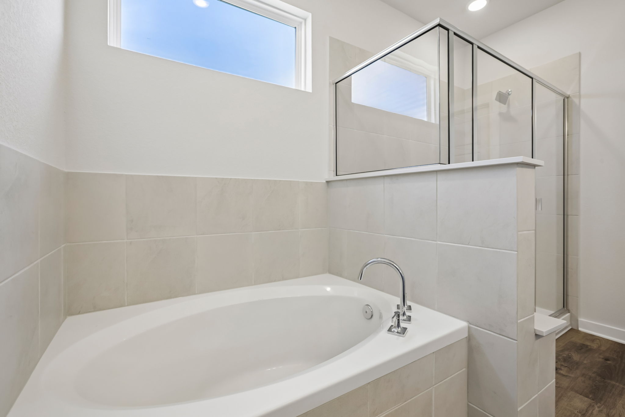 A bathroom with a glass shower.