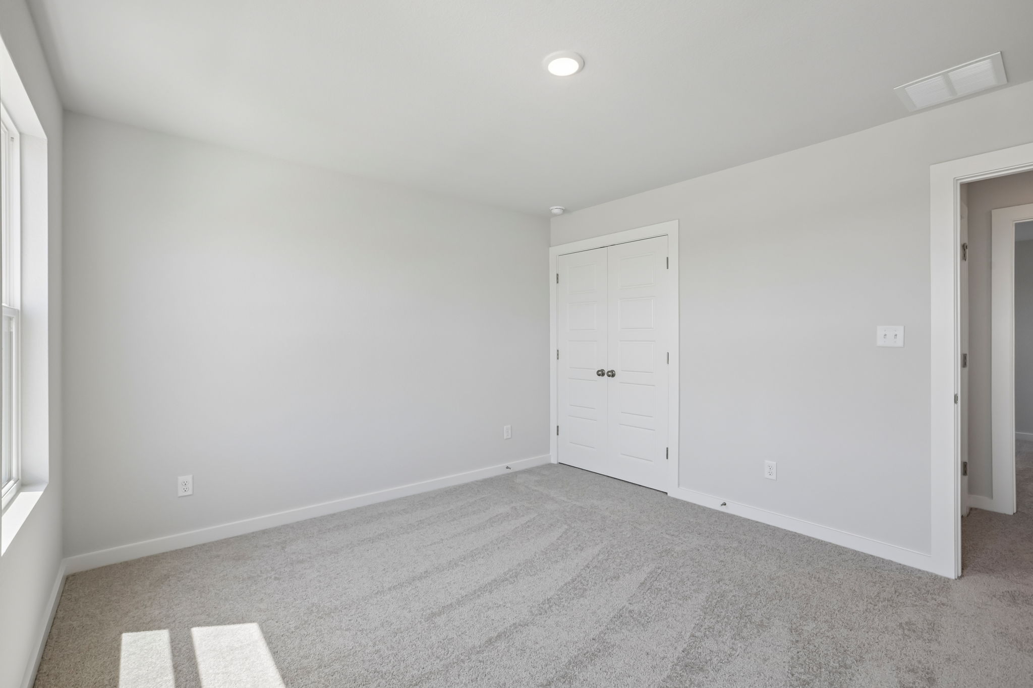A room with white doors.