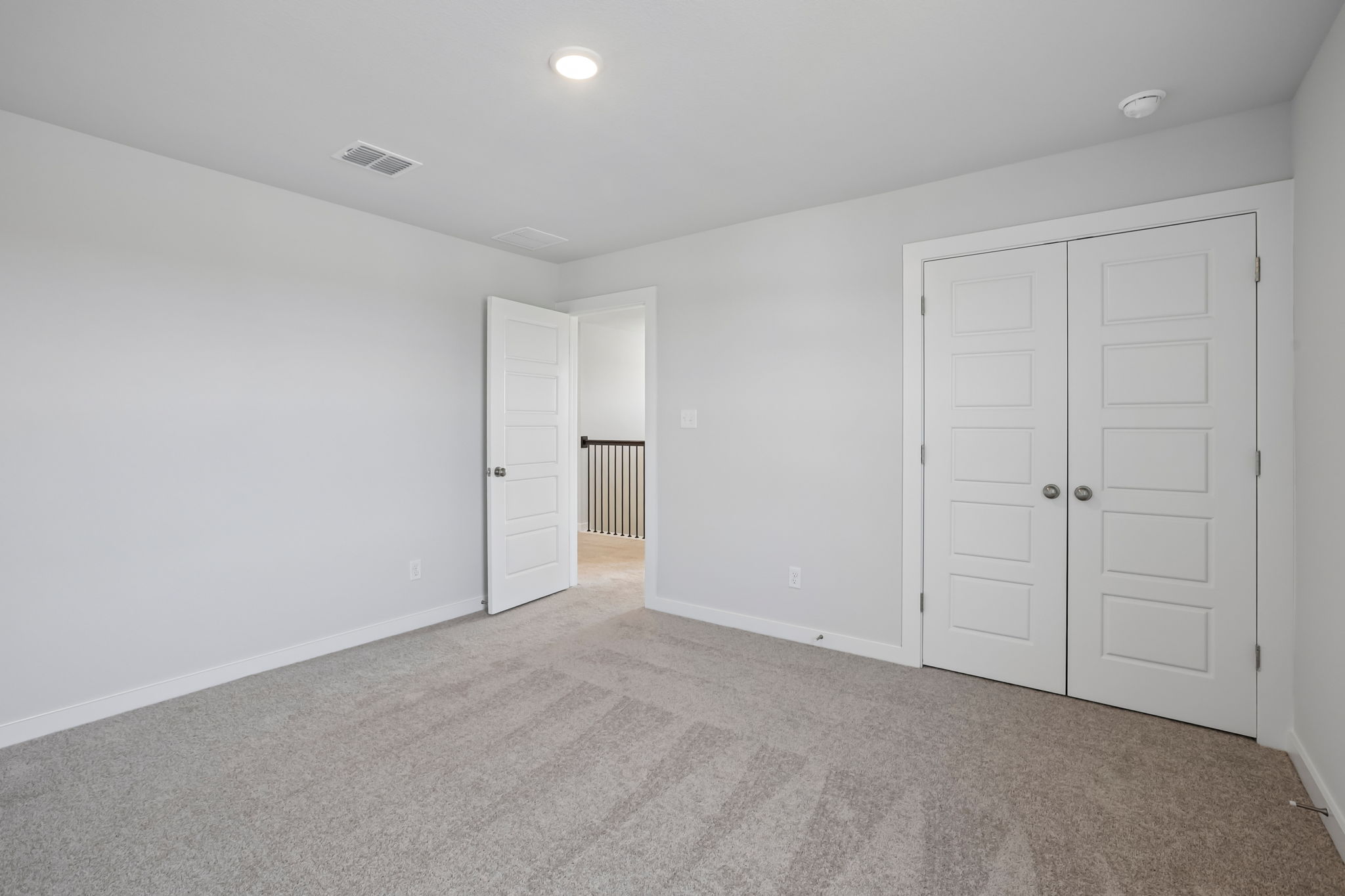 A room with white doors.