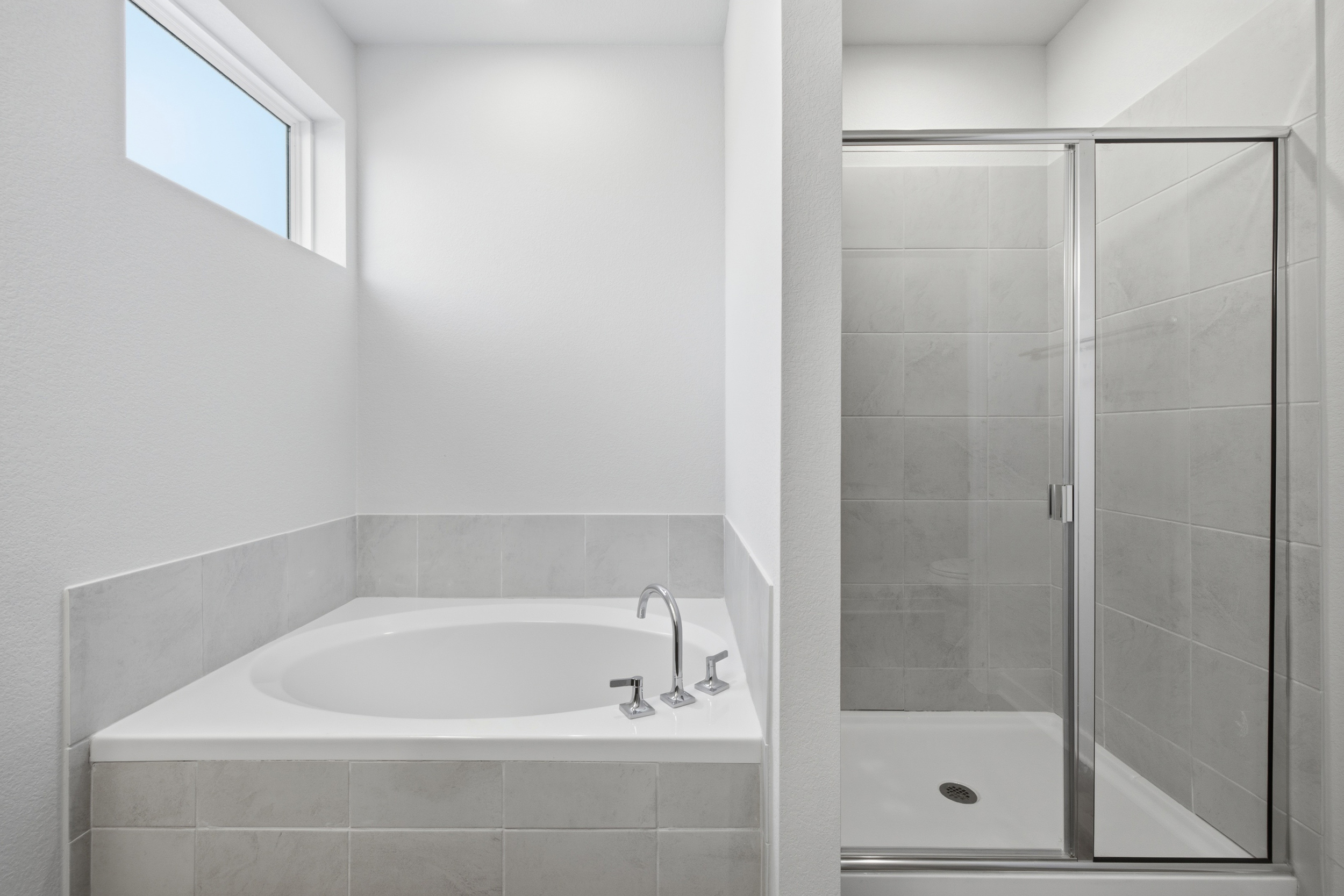 A bathroom with a glass shower.