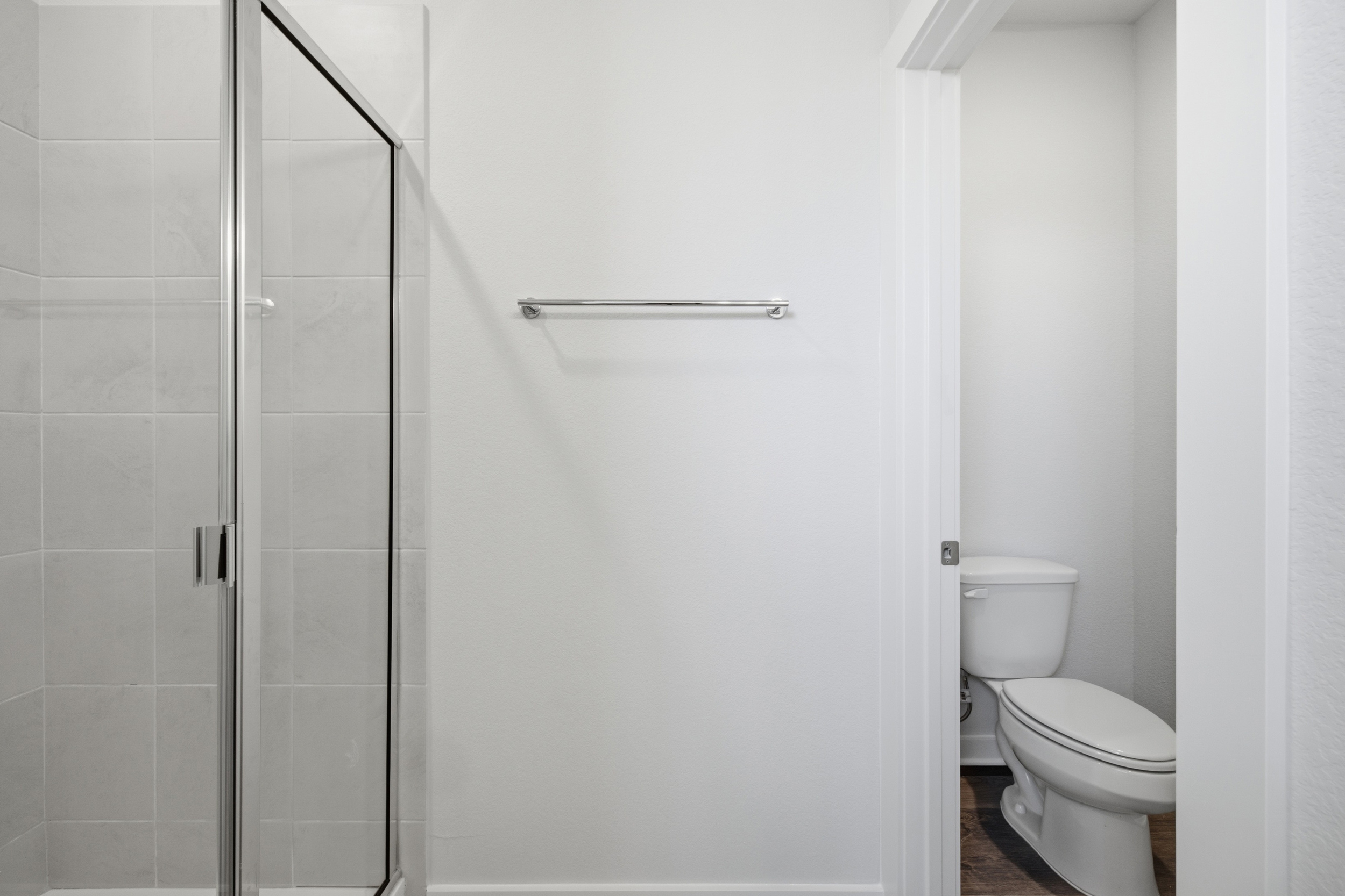 A bathroom with a shower unit.