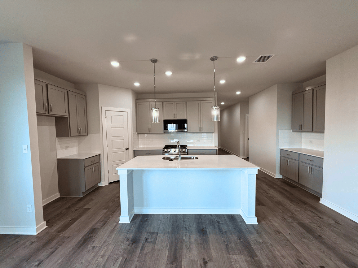 A large kitchen with a pool table.