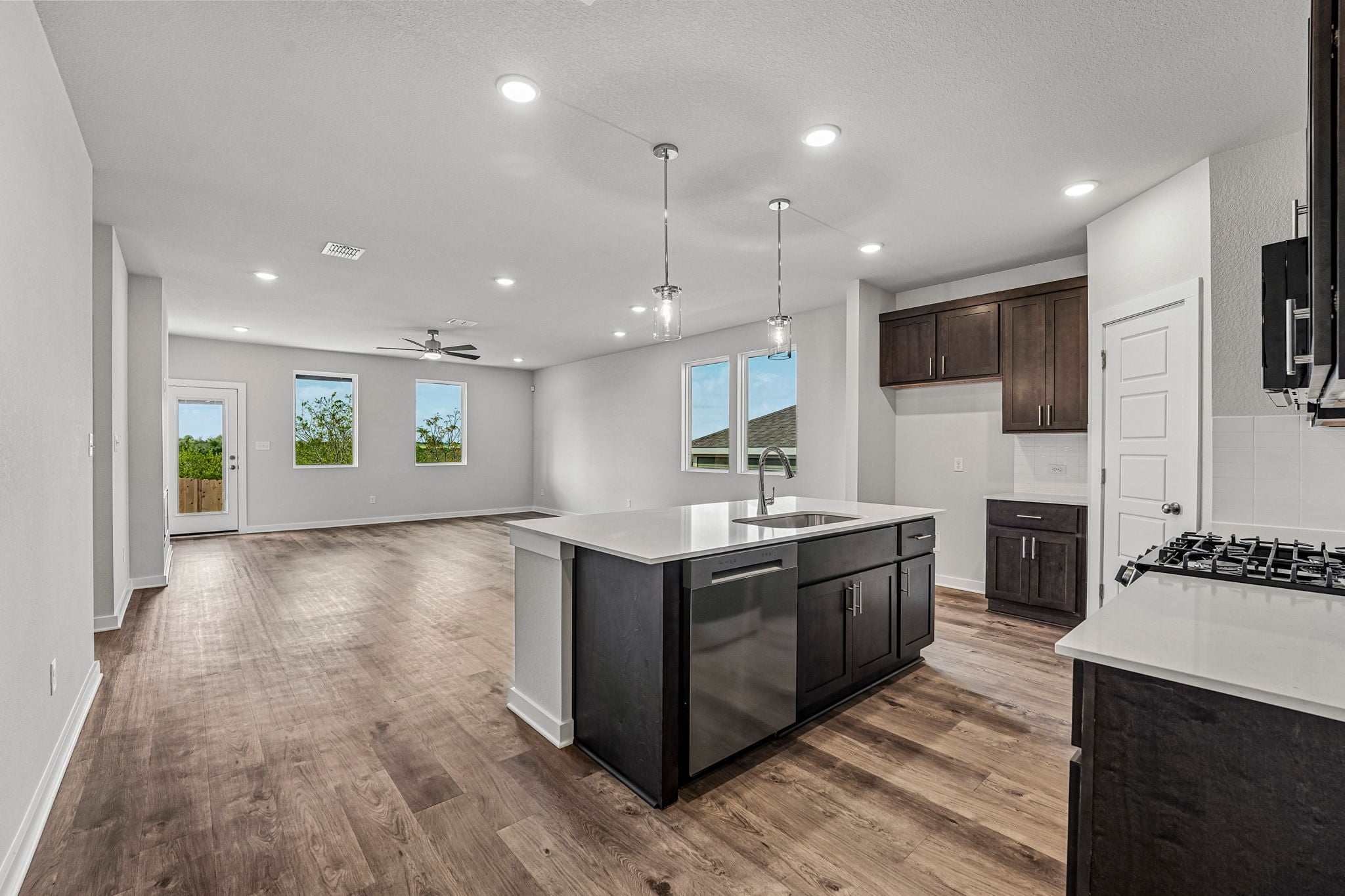 A kitchen with a wood floor.