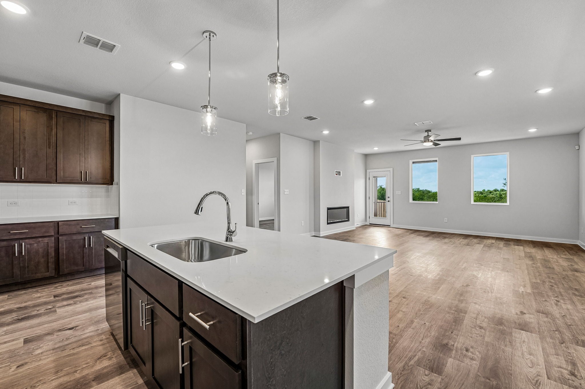 A kitchen with a marble island.