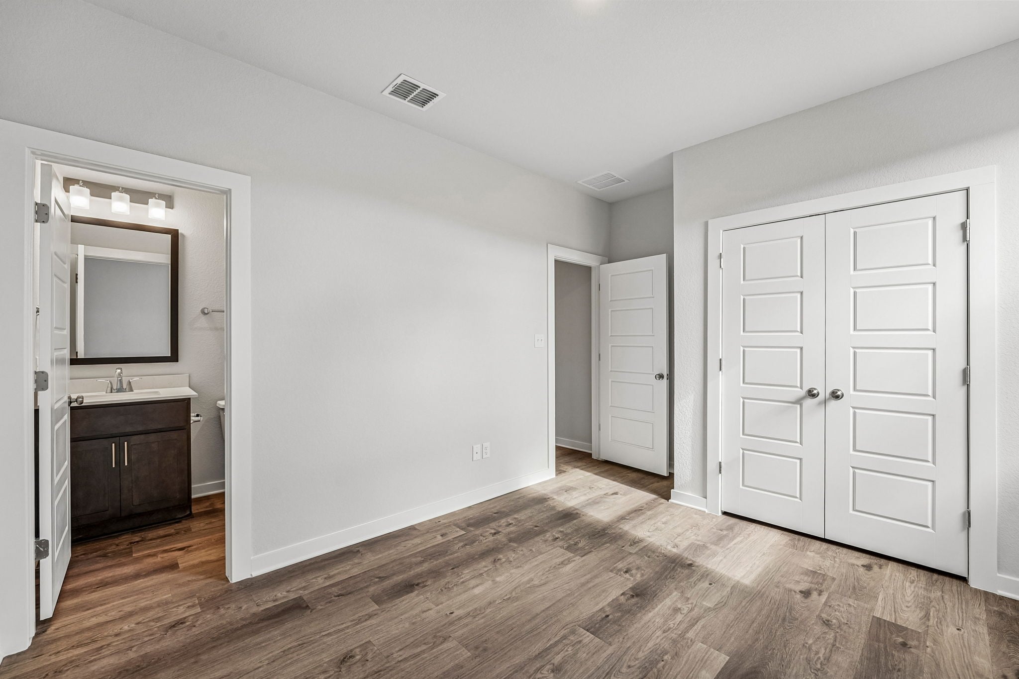 A room with white doors.