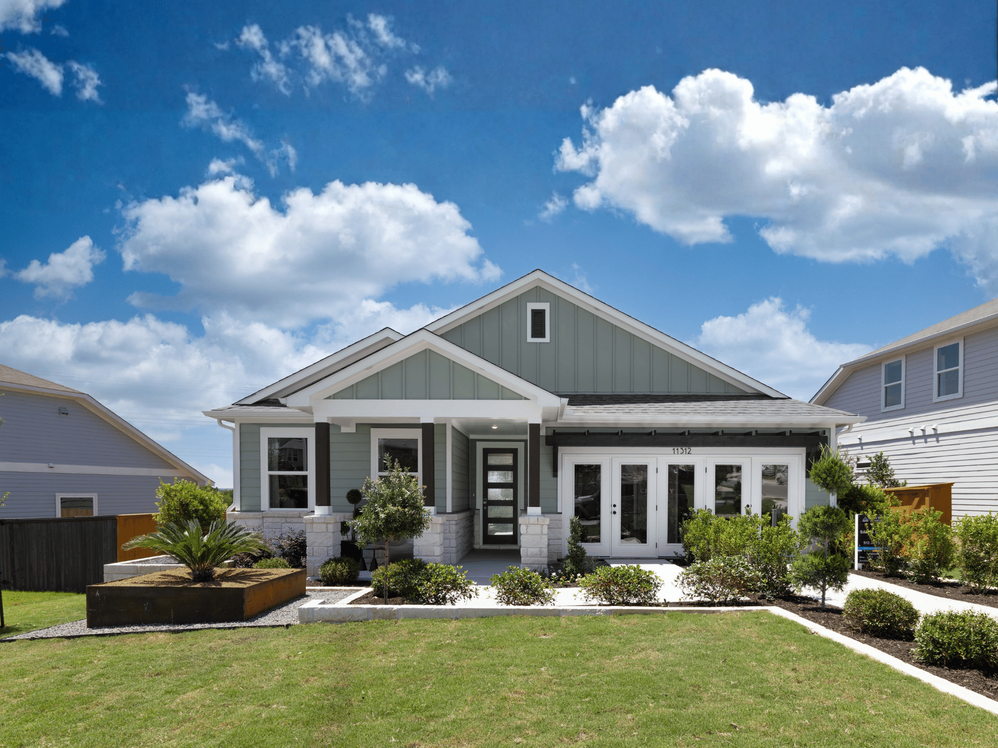 A house with a lawn and a large yard.