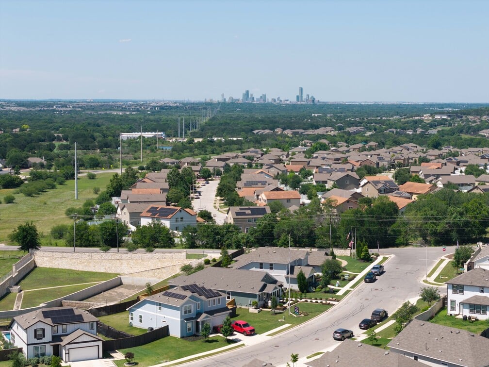 A city with many buildings and trees.