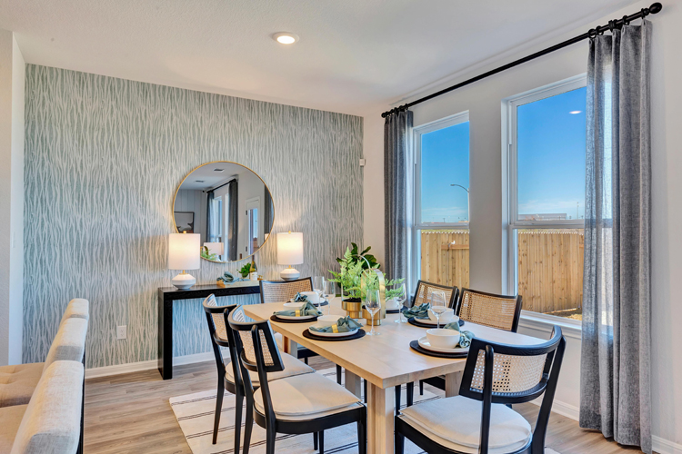 A dining room with a large window.