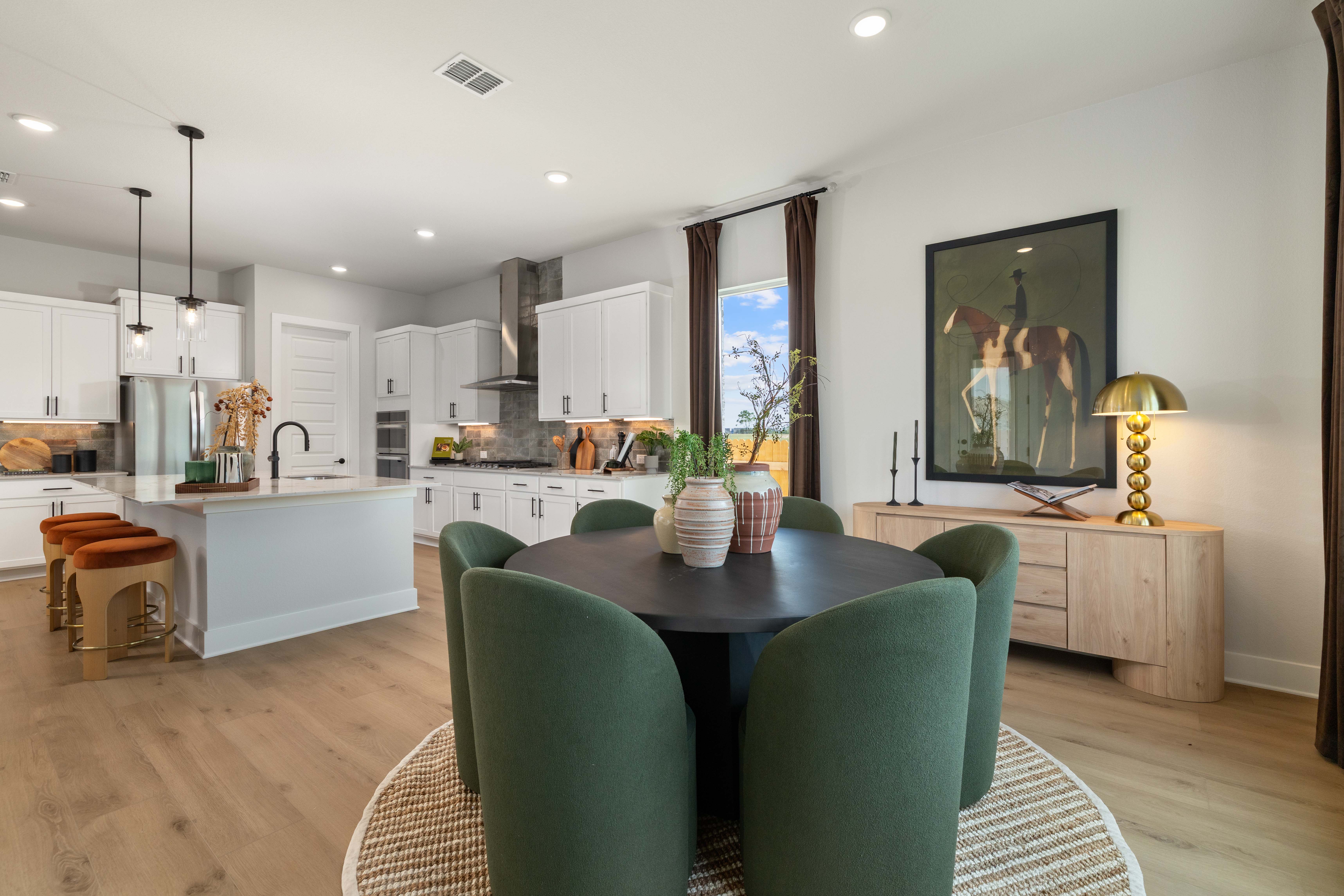 A kitchen with a dining table.
