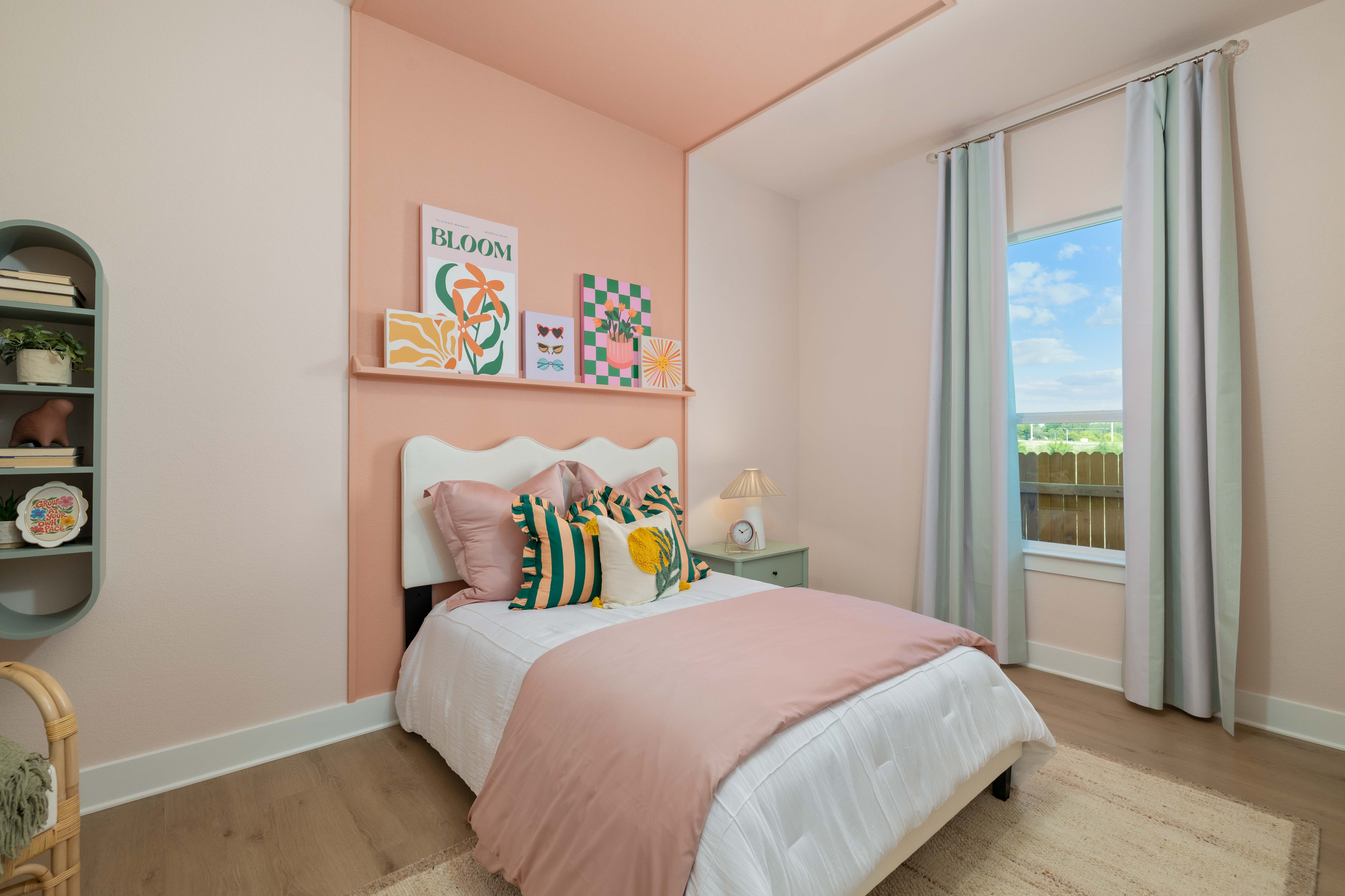 A bedroom with a large window.