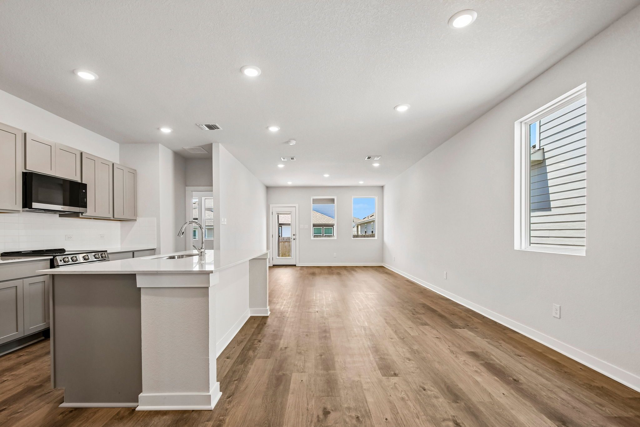 A kitchen with white walls.
