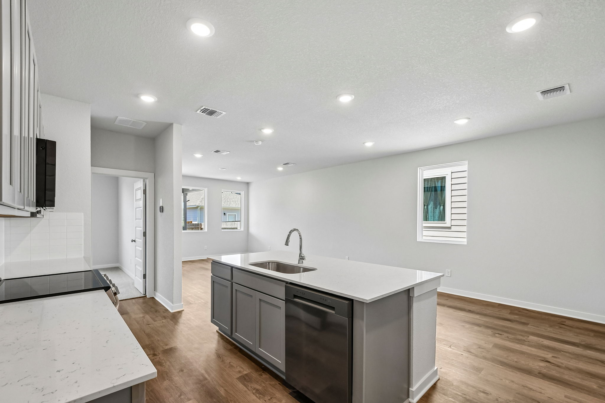 A kitchen with a sink and cabinets.