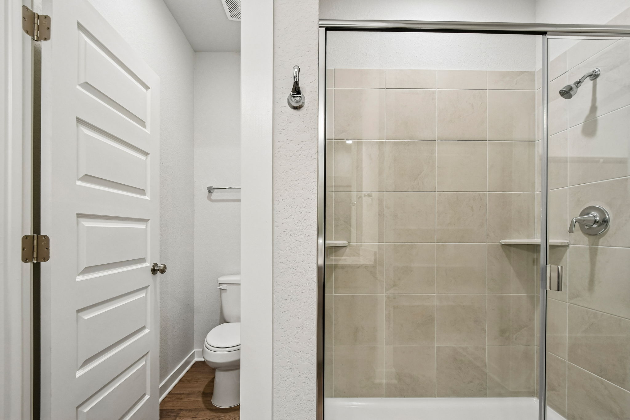 A bathroom with a glass shower.