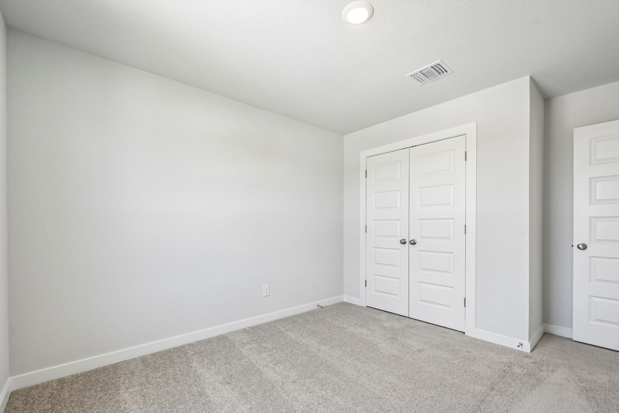 A room with white doors.