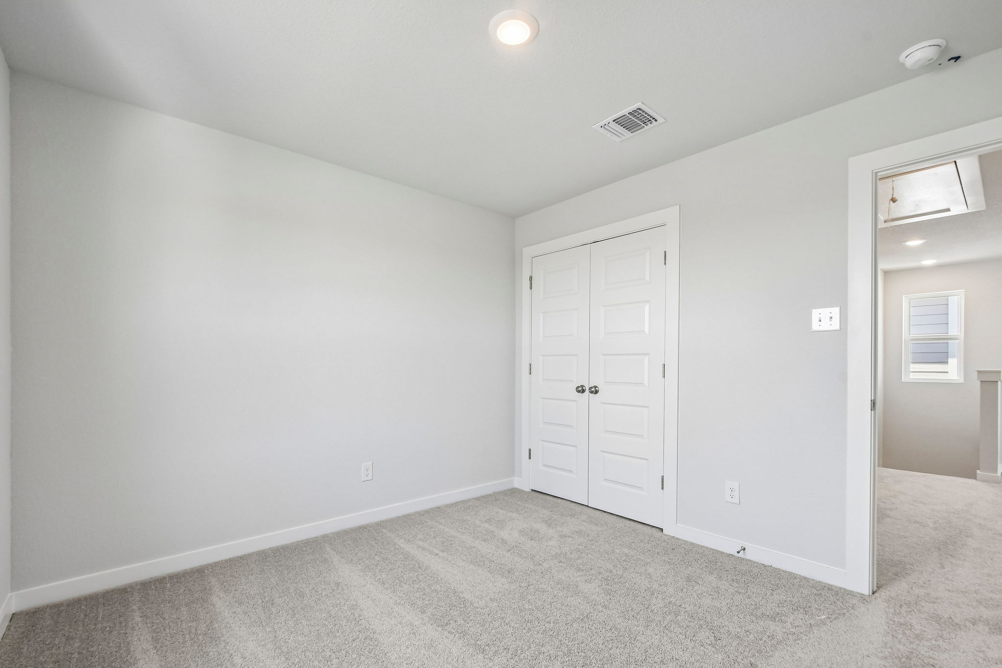 A room with white doors.