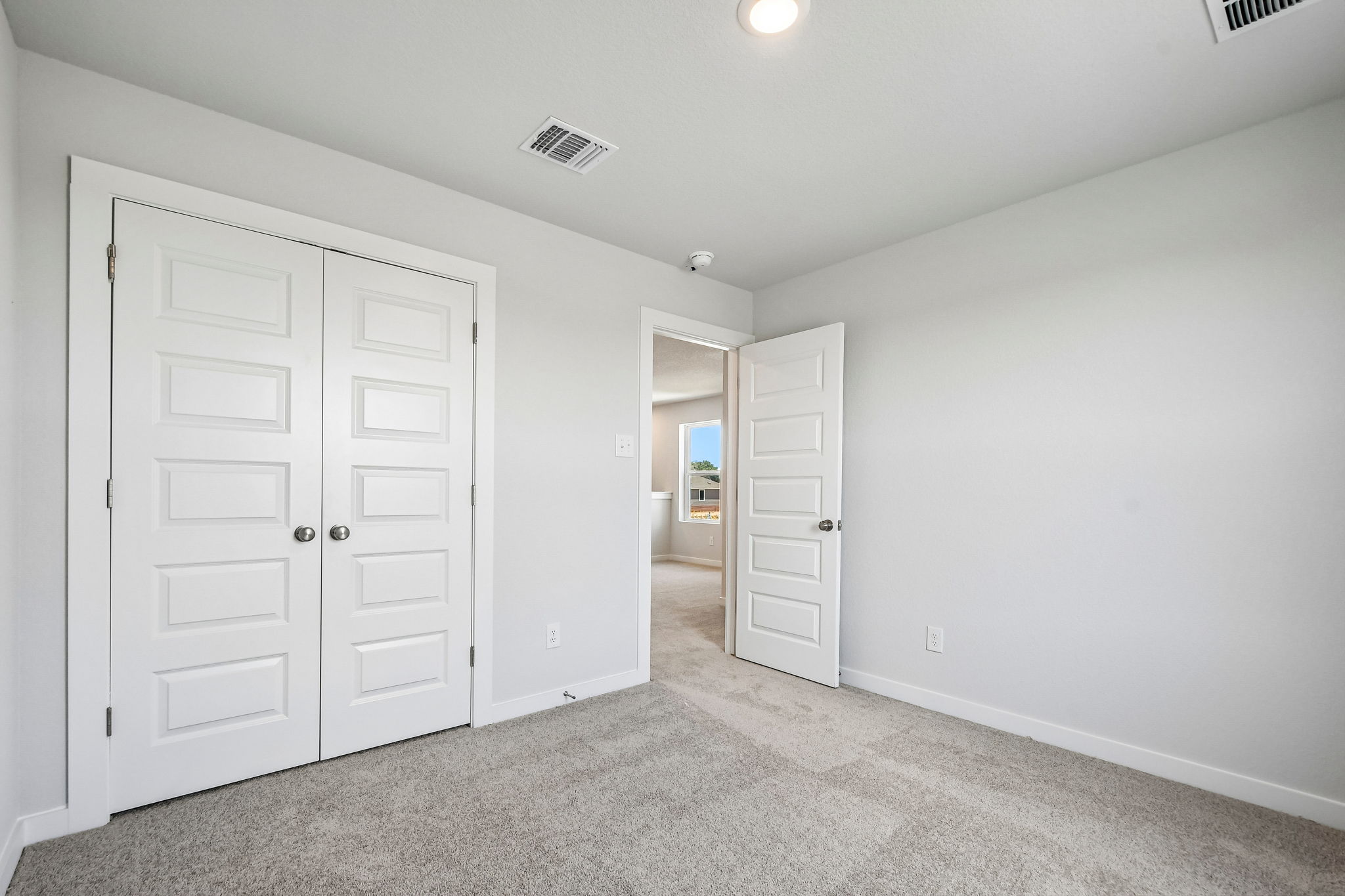 A room with white doors.