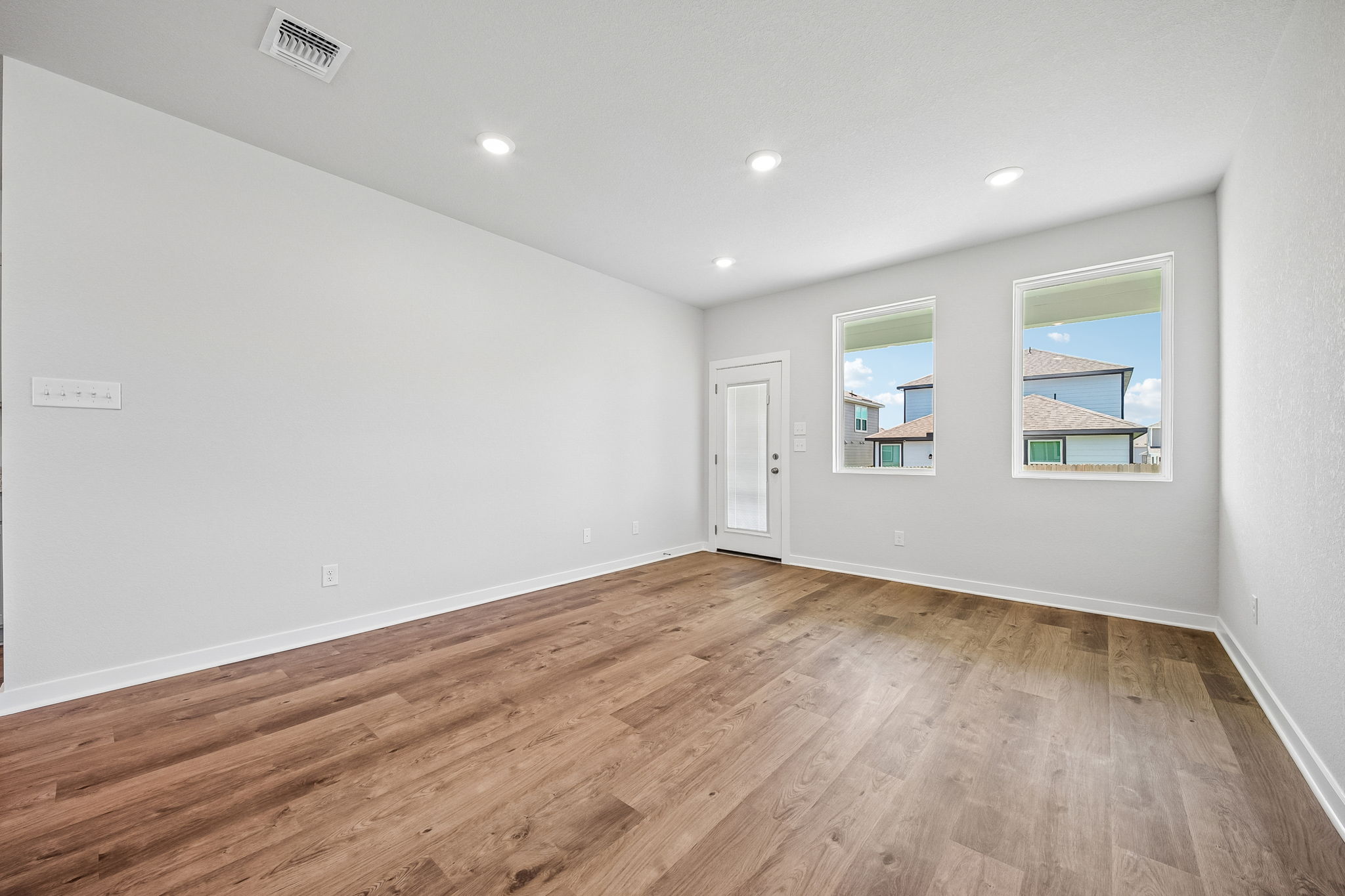 A room with a wood floor and a wood floor.