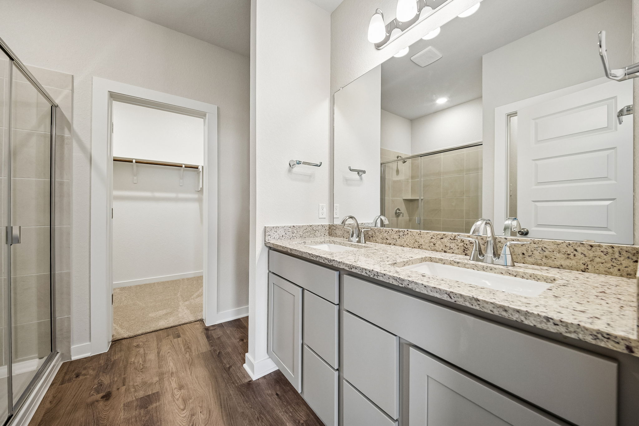 A bathroom with a marble countertop.