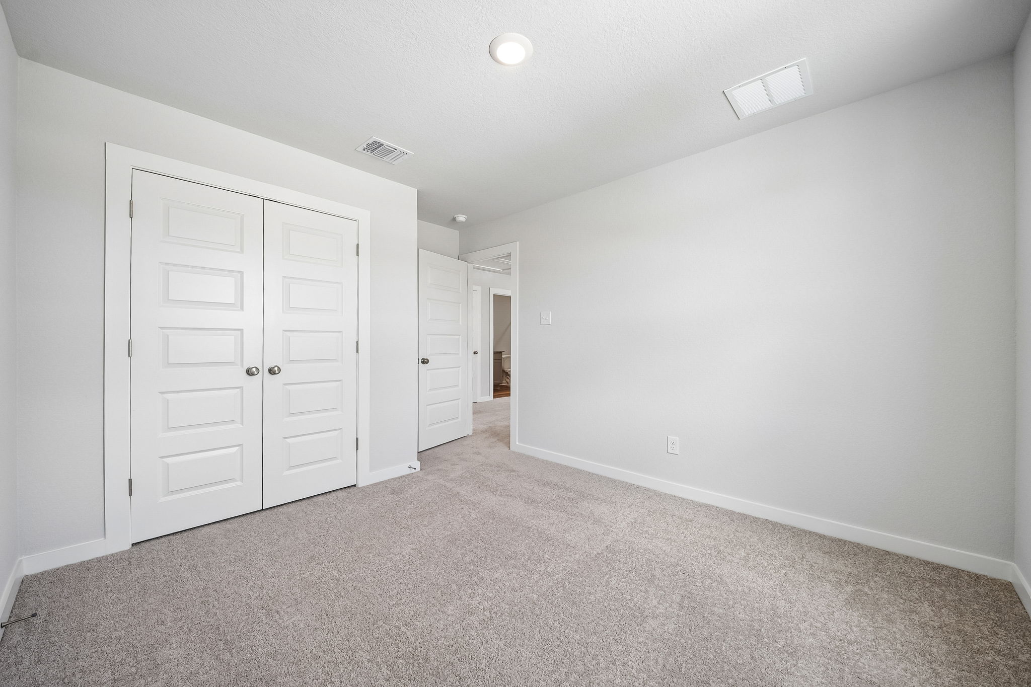 A room with white doors.