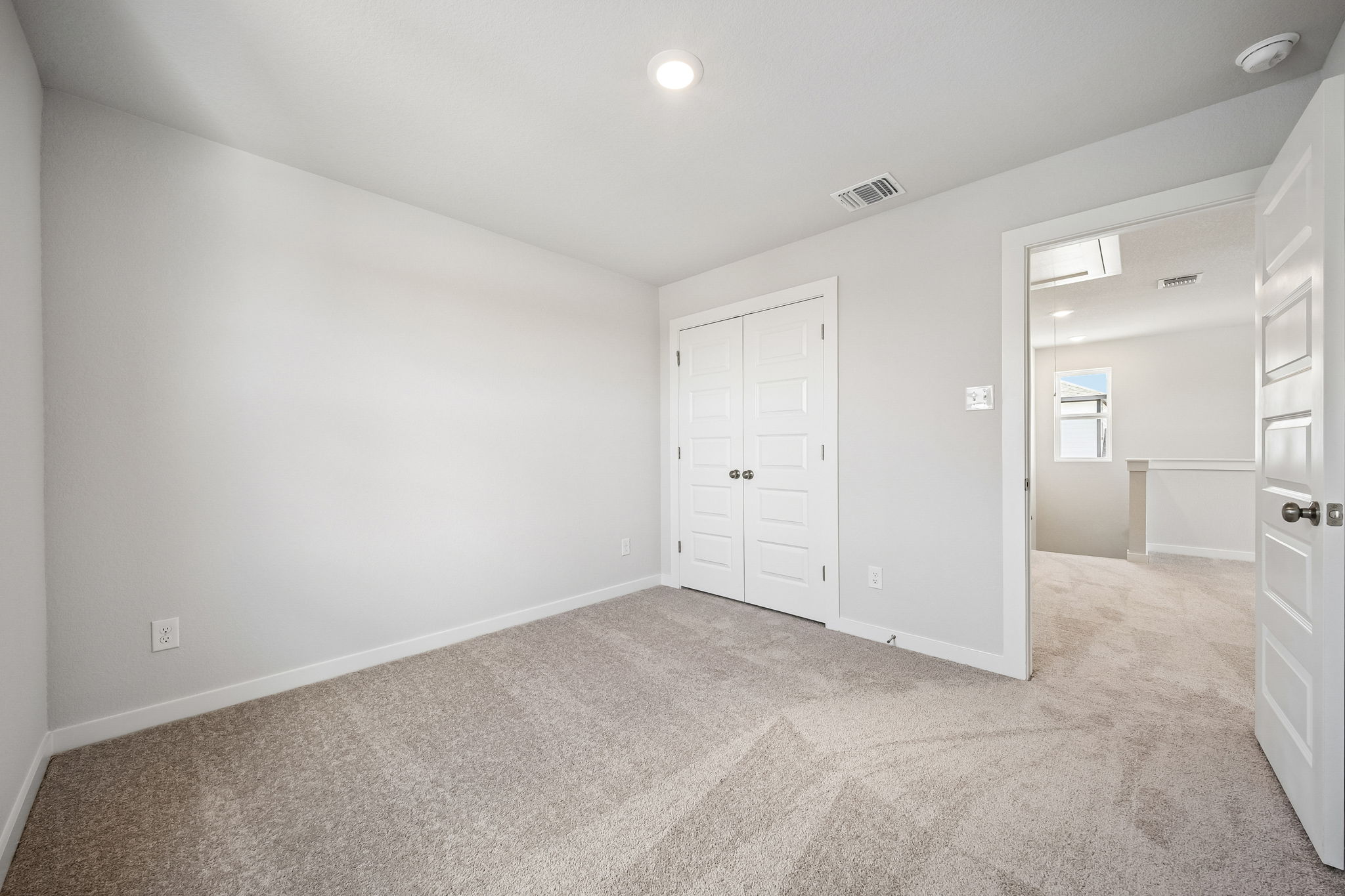 A room with white doors.