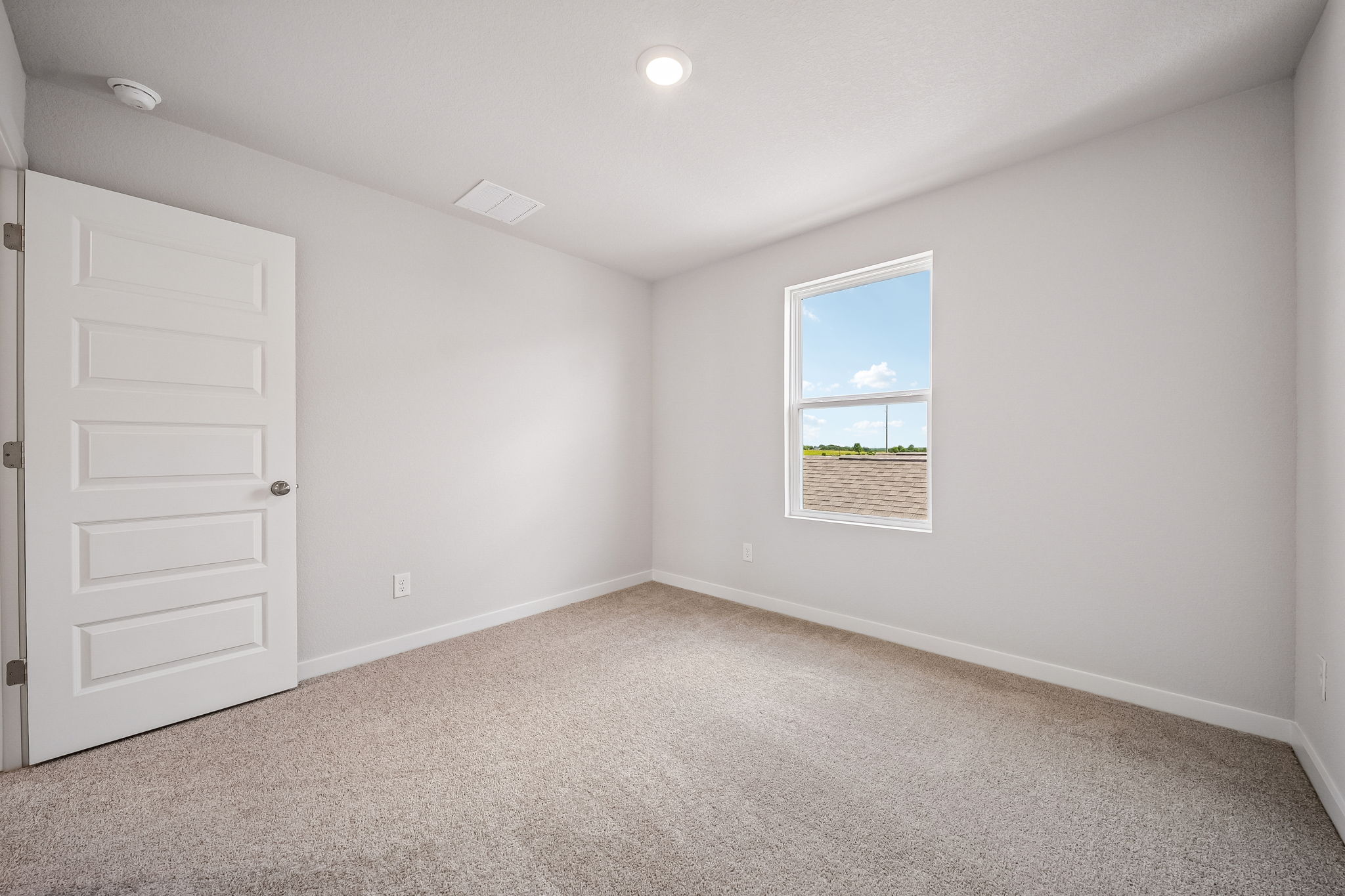 A room with a window and a door.