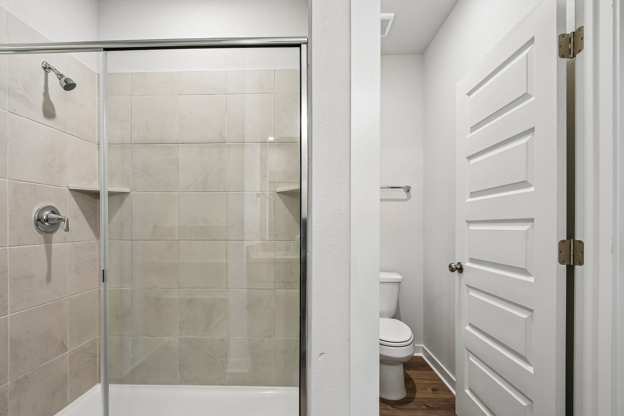 A bathroom with a glass shower.