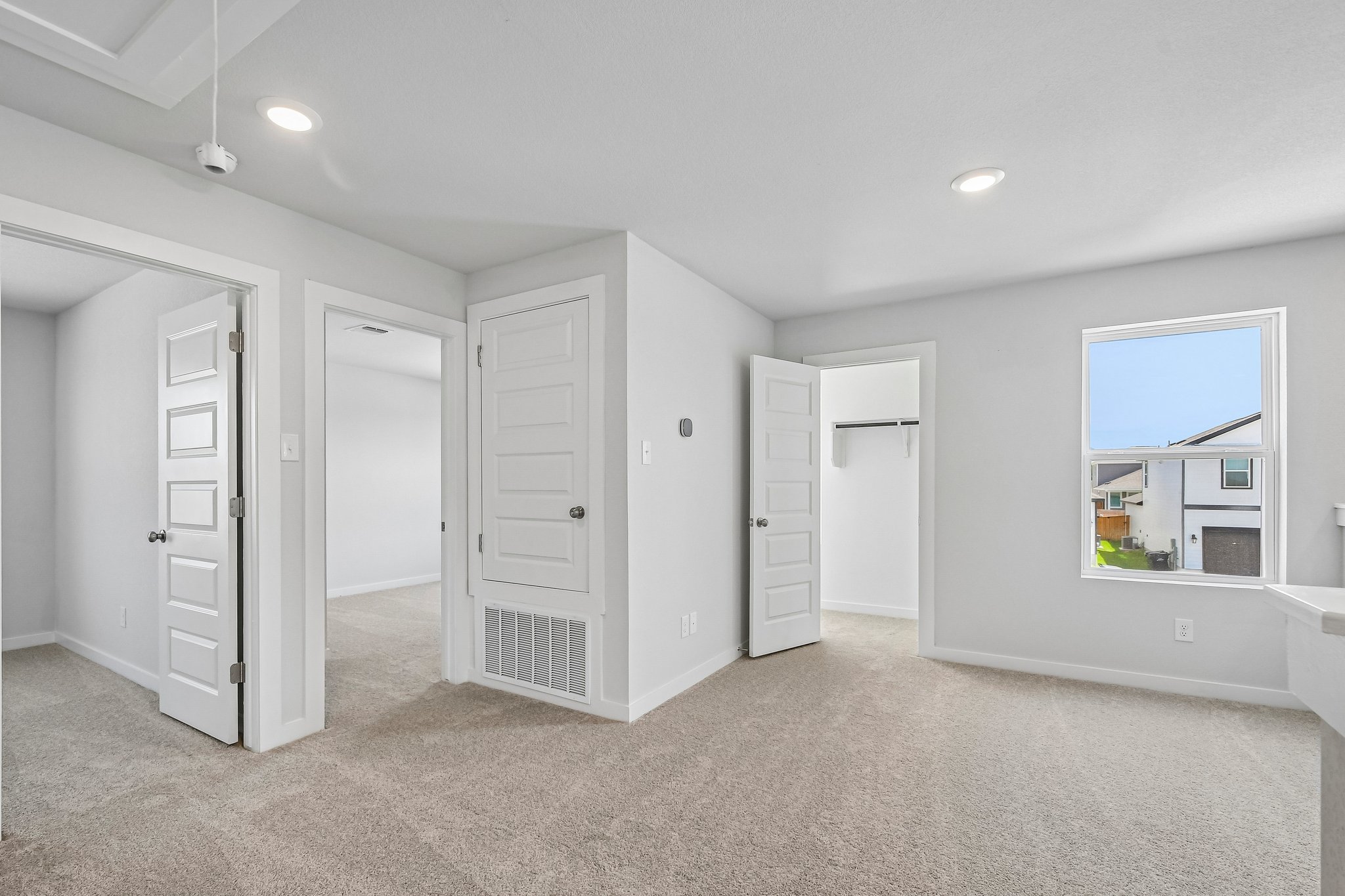 A room with white cabinets.