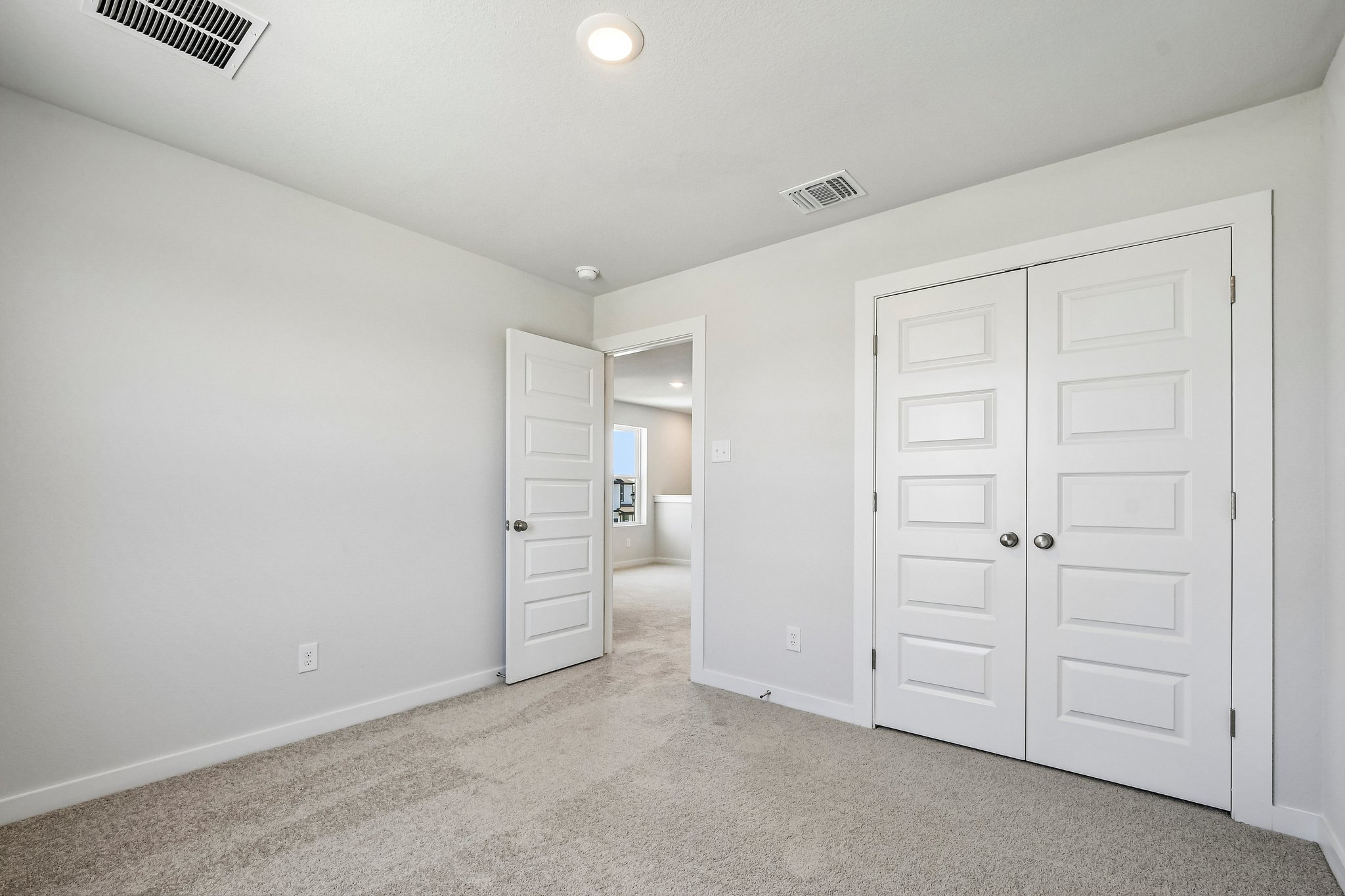 A room with white doors.