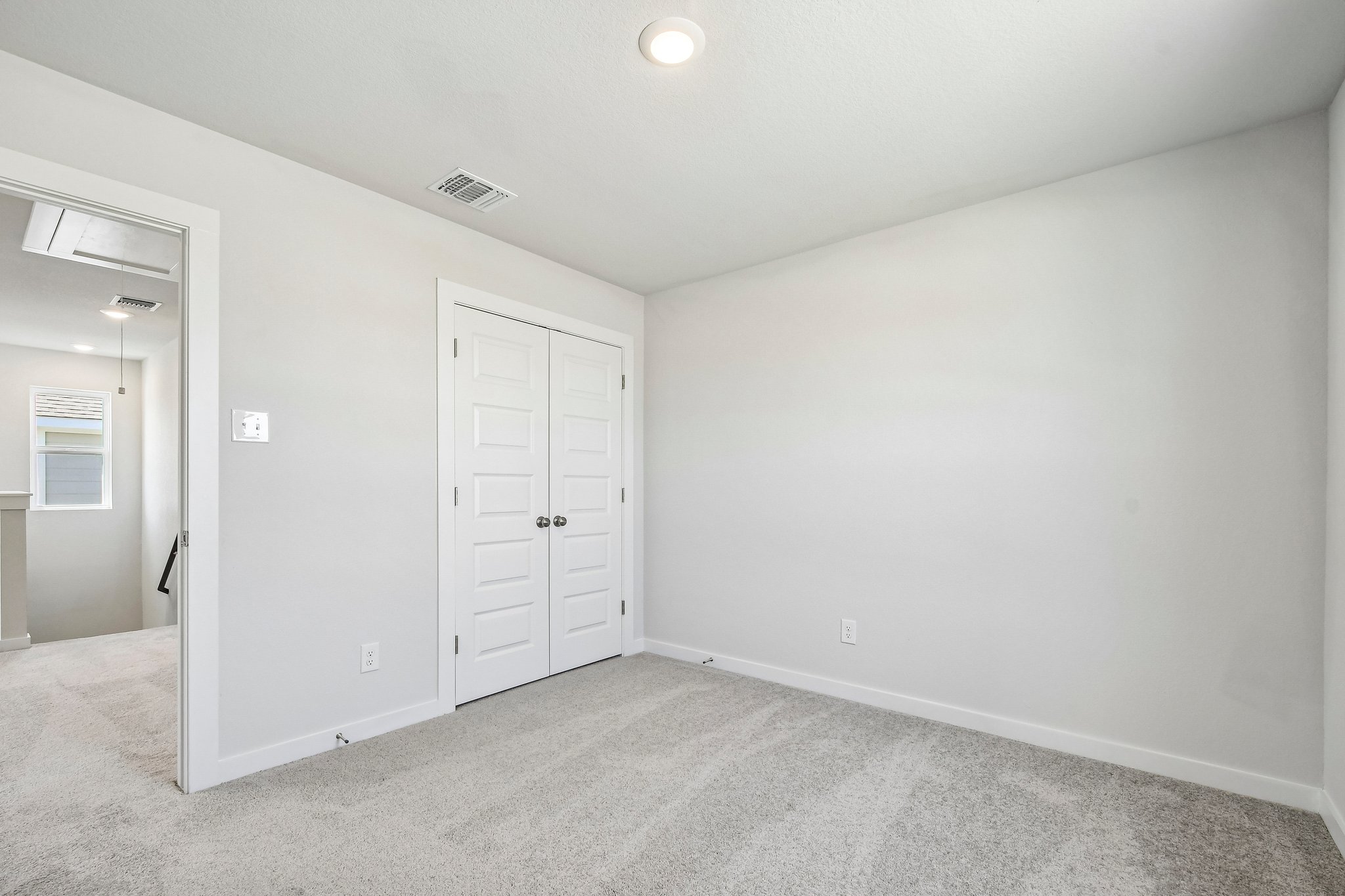 A room with white doors.