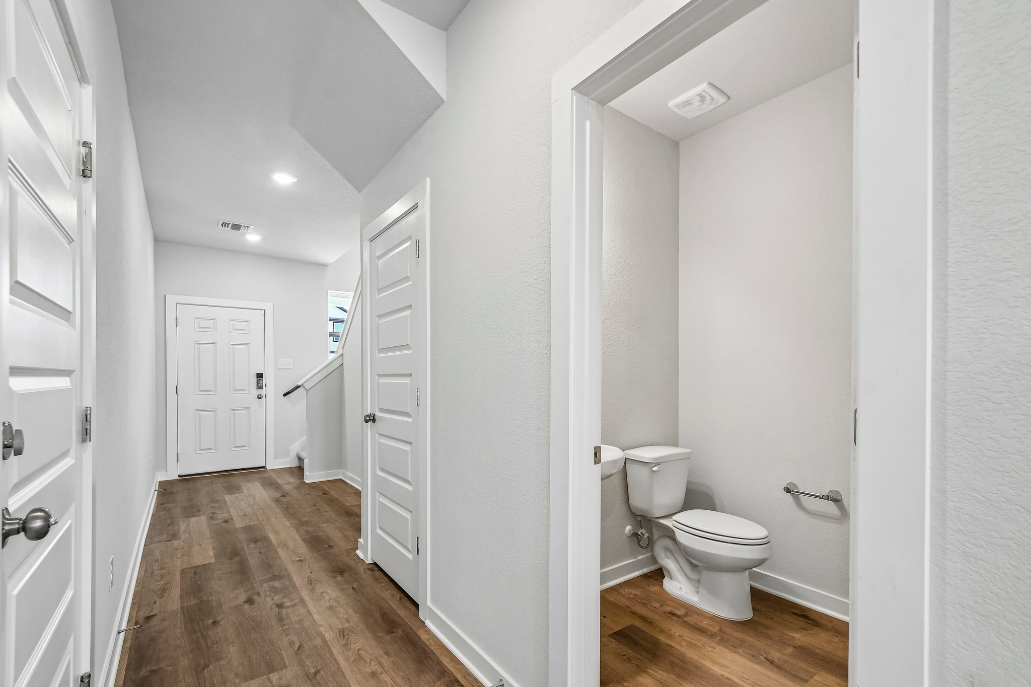 A bathroom with white walls.