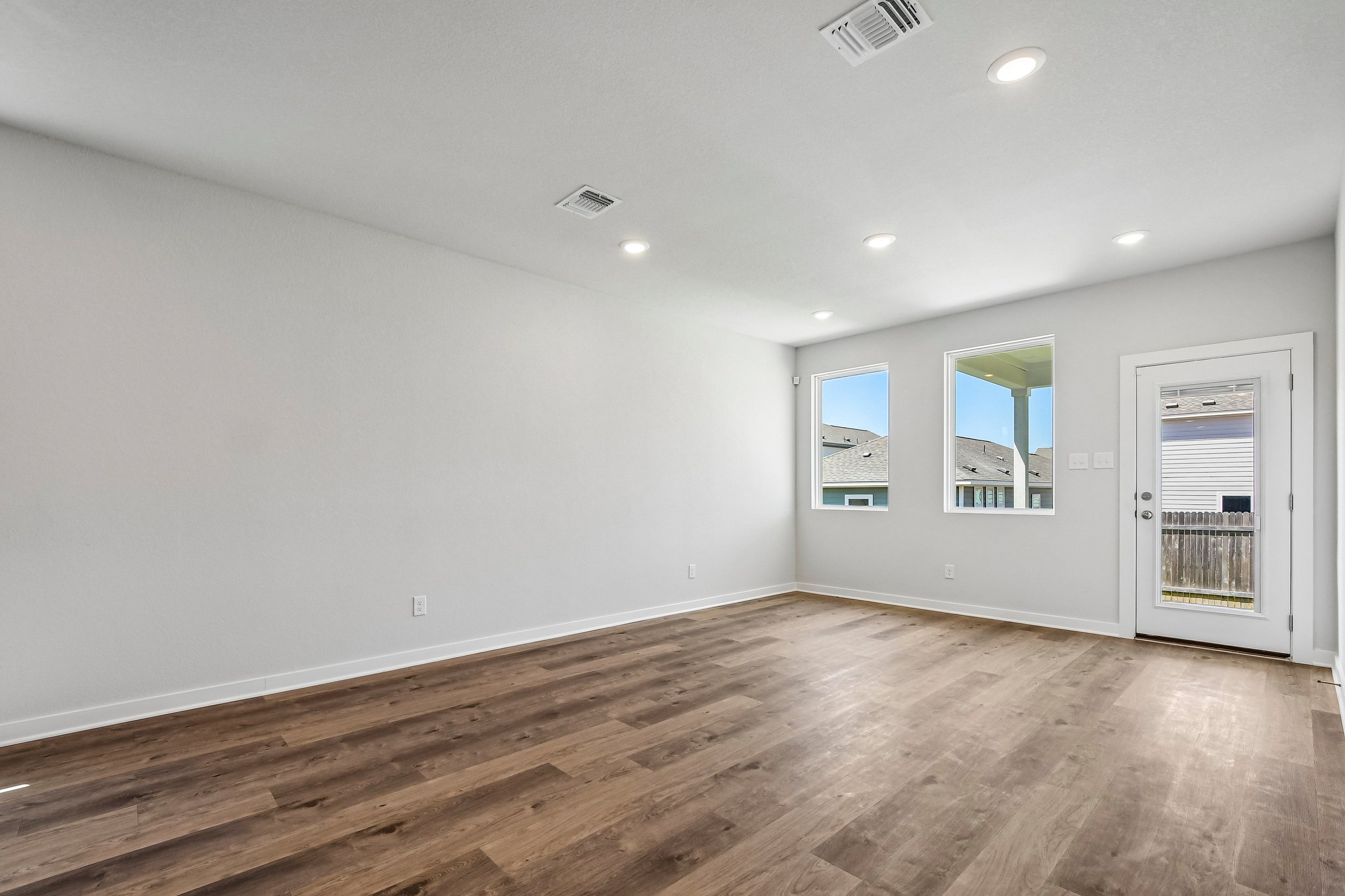 A room with a wood floor and a wood floor.