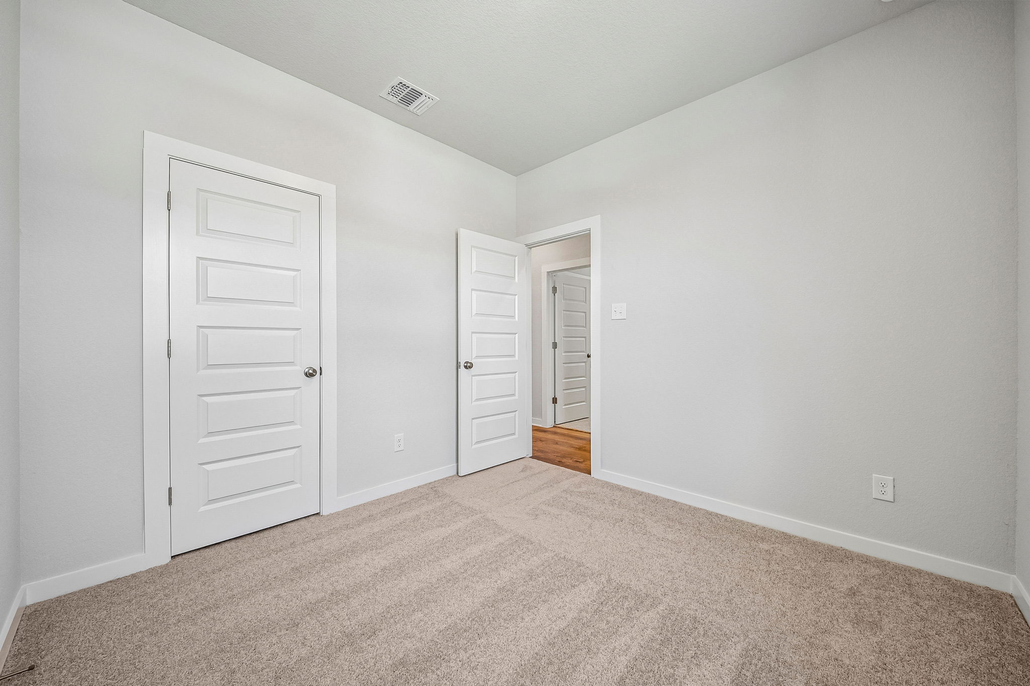A room with white doors.