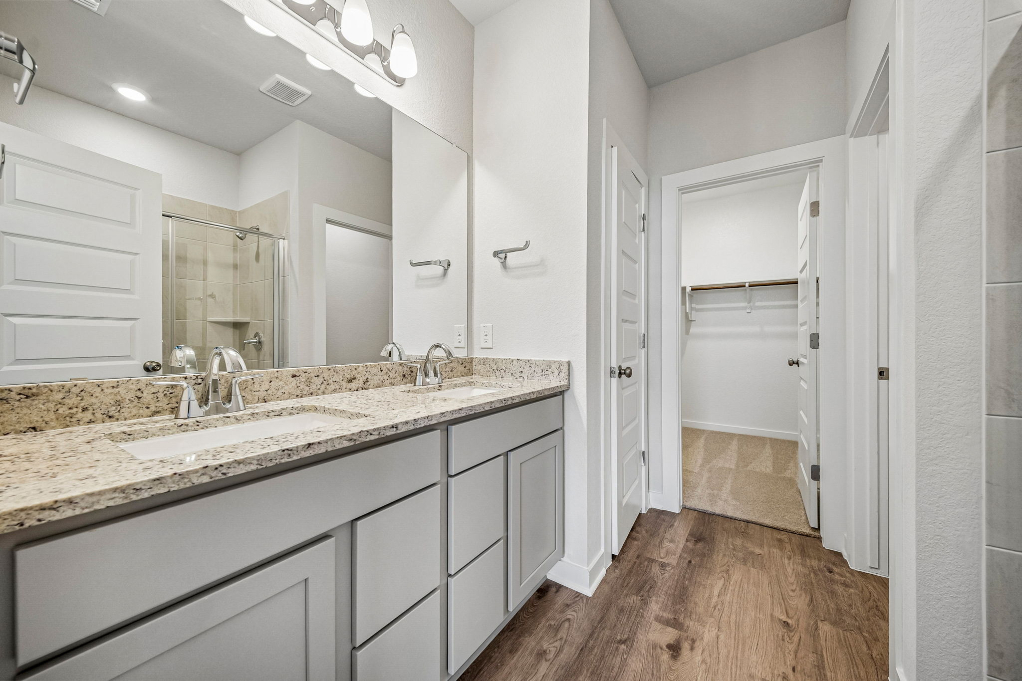 A bathroom with a marble countertop.
