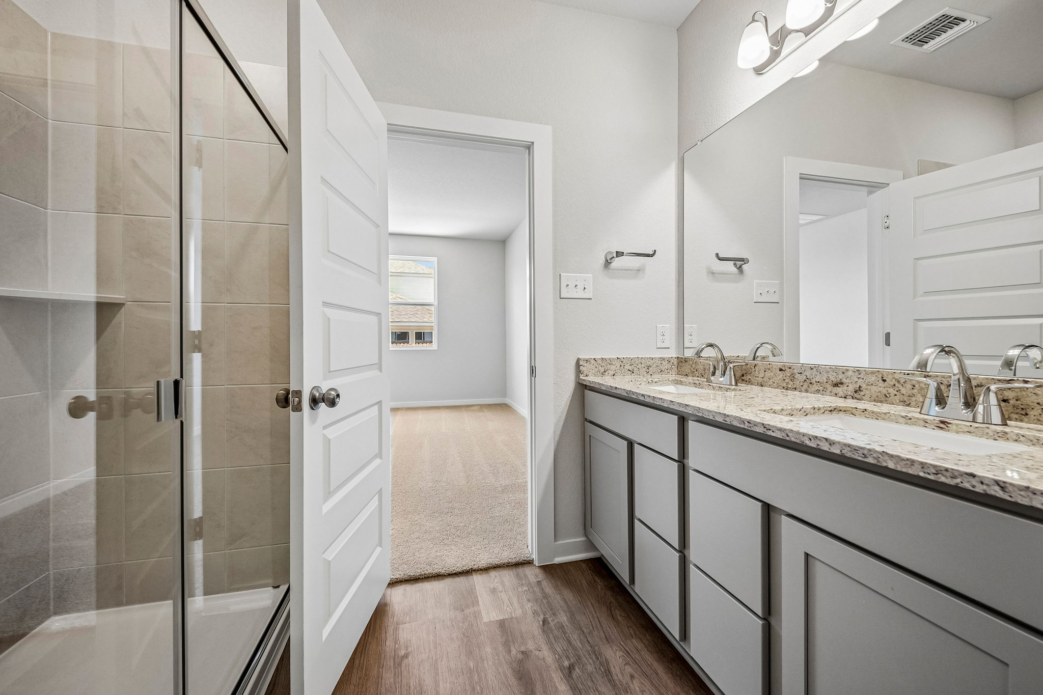 A bathroom with a marble countertop.