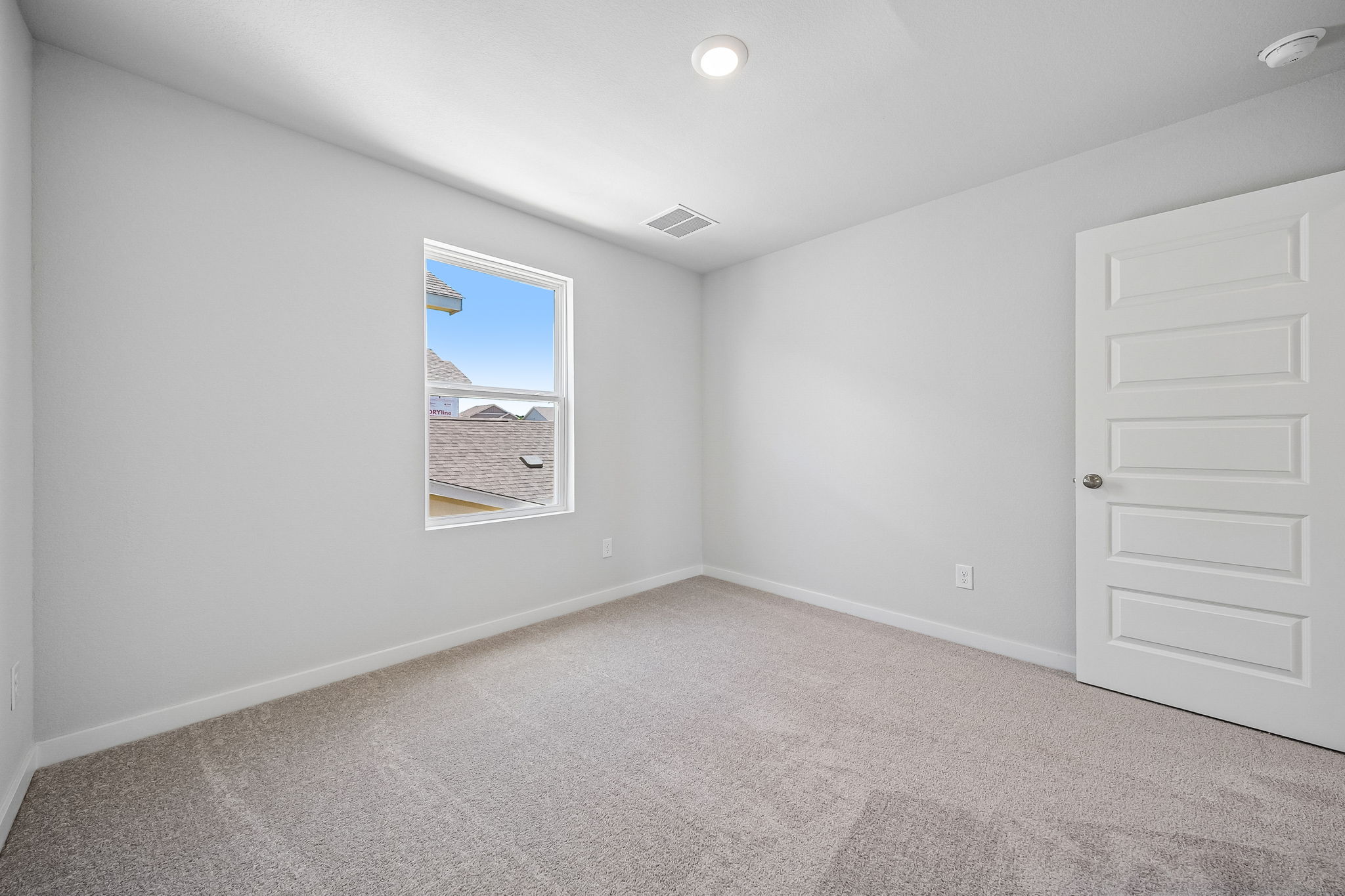A room with a painting on the wall.
